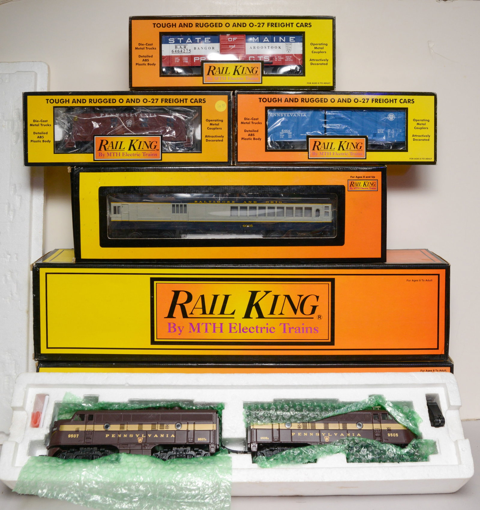 Two Railking Locomotives and Four Cars.: Pennsylvania 462 engine, F-3 ABA Diesel Set, Doodlebug car, three cars.