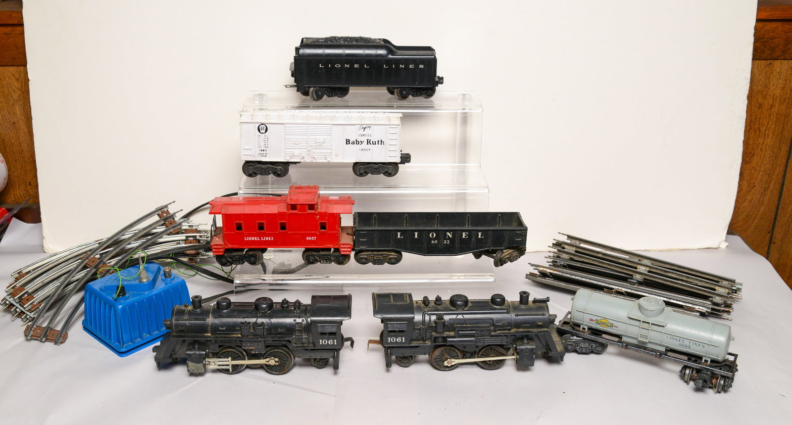Two Lionel Locomotives, Tender, Four Cars, Track and Transformer.: Locomotives 1061, Baby Ruth Candy box car, 6057 caboose, 6032, 6035 tanker.