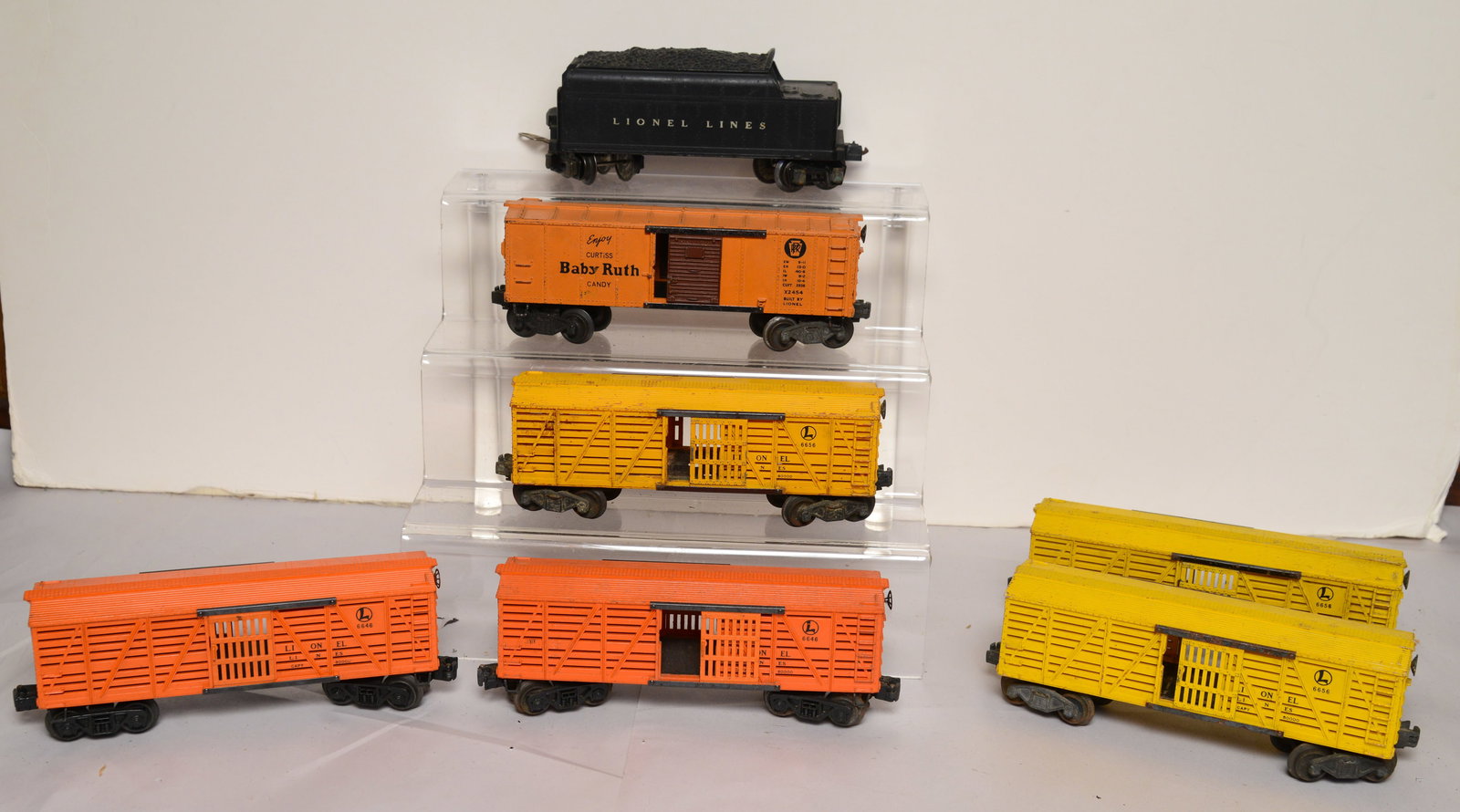 Lionel Coal Tender and Six Box Cars.: Good condition, some scratches.