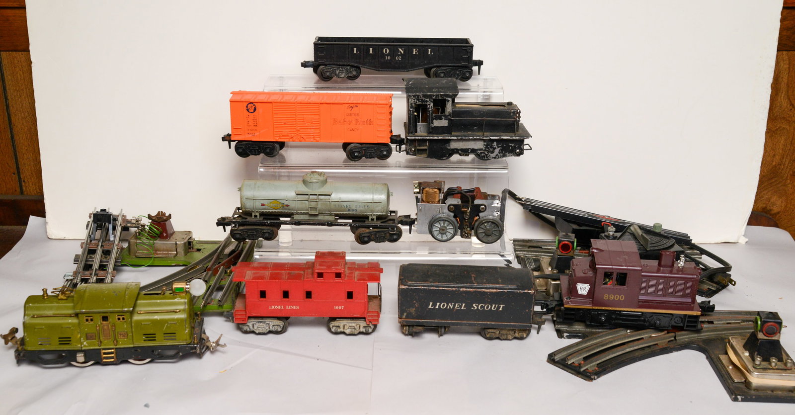 Three Locomotives and Five Train Cars.: Some wear and damage. Also includes two switches and transformer.