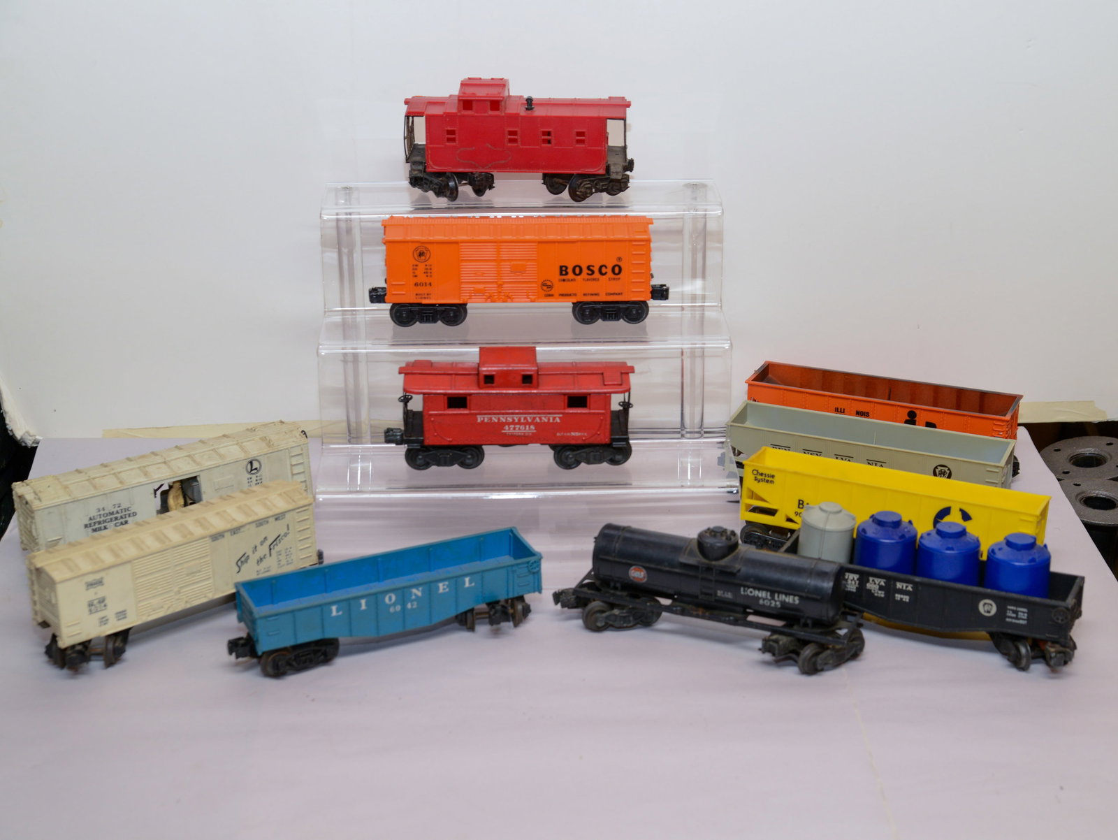Eleven O Gauge Train Cars: Lionel, Bosco, Pennsylvania and others.