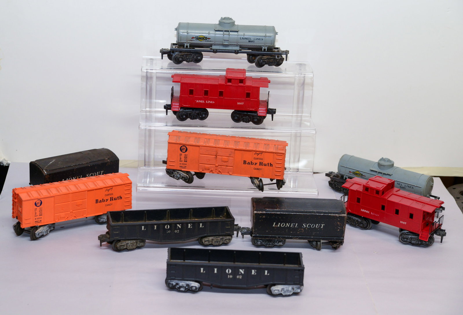 Ten Lionel O Gauge Train Cars.: Baby Ruth, Sunoco, and others.