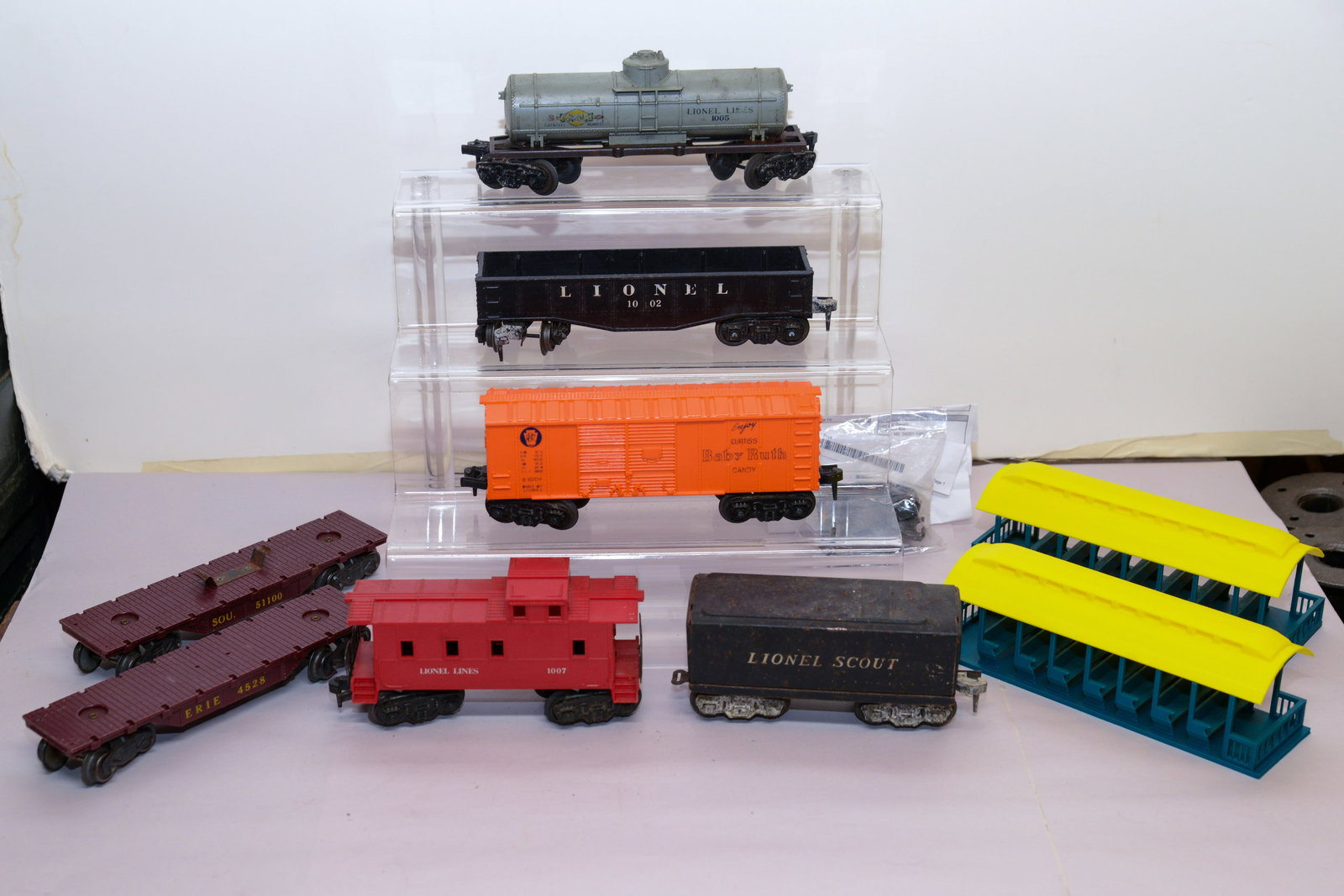 Seven Lionel O Gauge Train Cars.: Fair condition, some scratches.