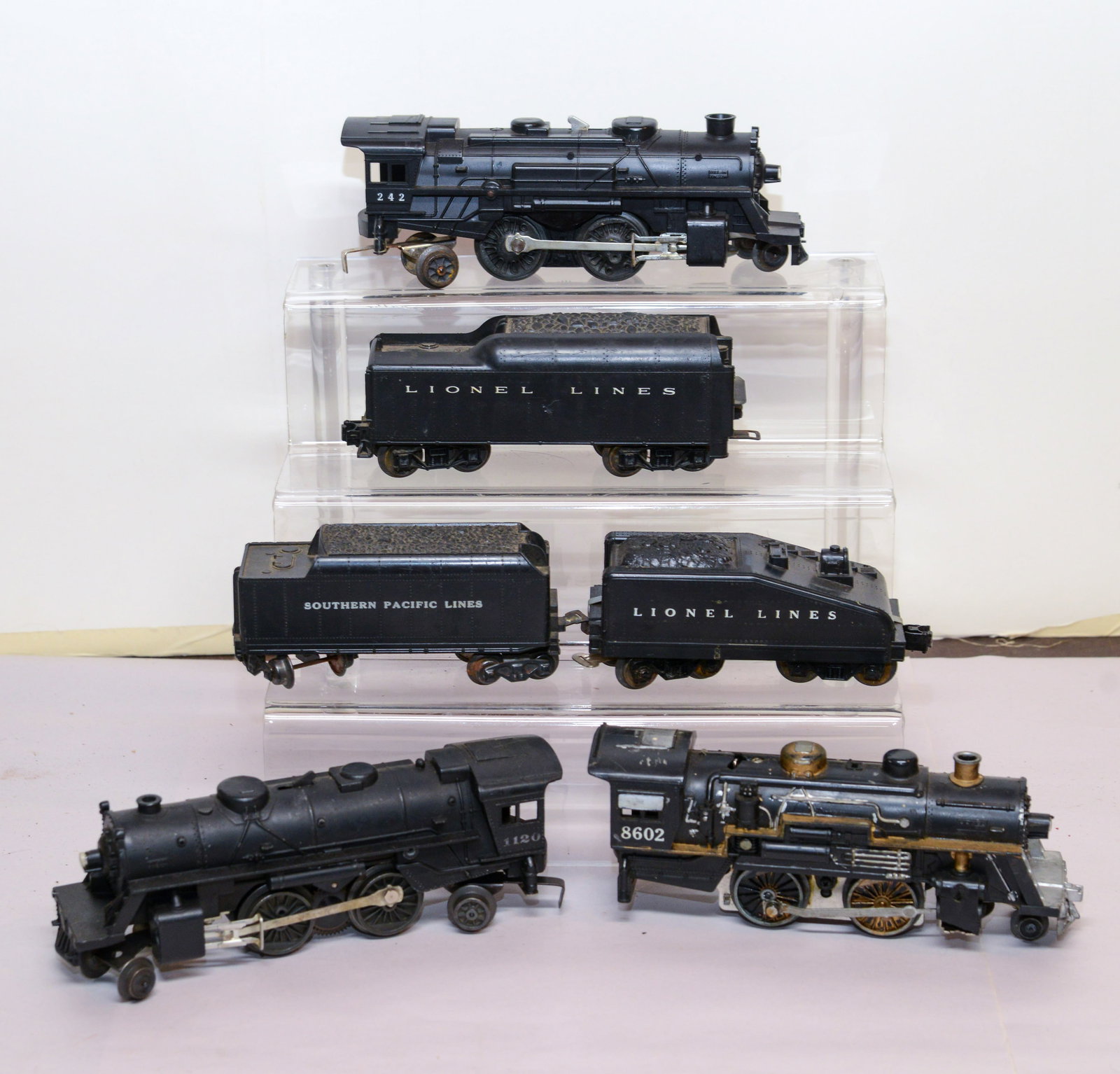 Three Lionel Locomotives and Tenders.: 242, 11020, 8602. Good condition, not tested for operation.