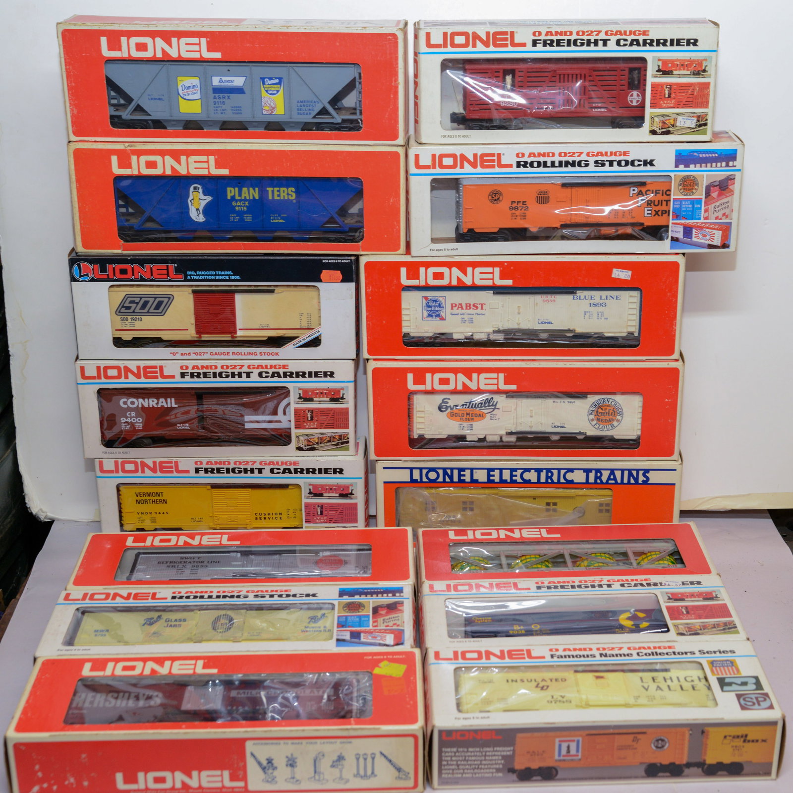 Sixteen Lionel New in Box Train Cars.: Hershey's, Planters, Domino, Heinz, Pabst, and others.