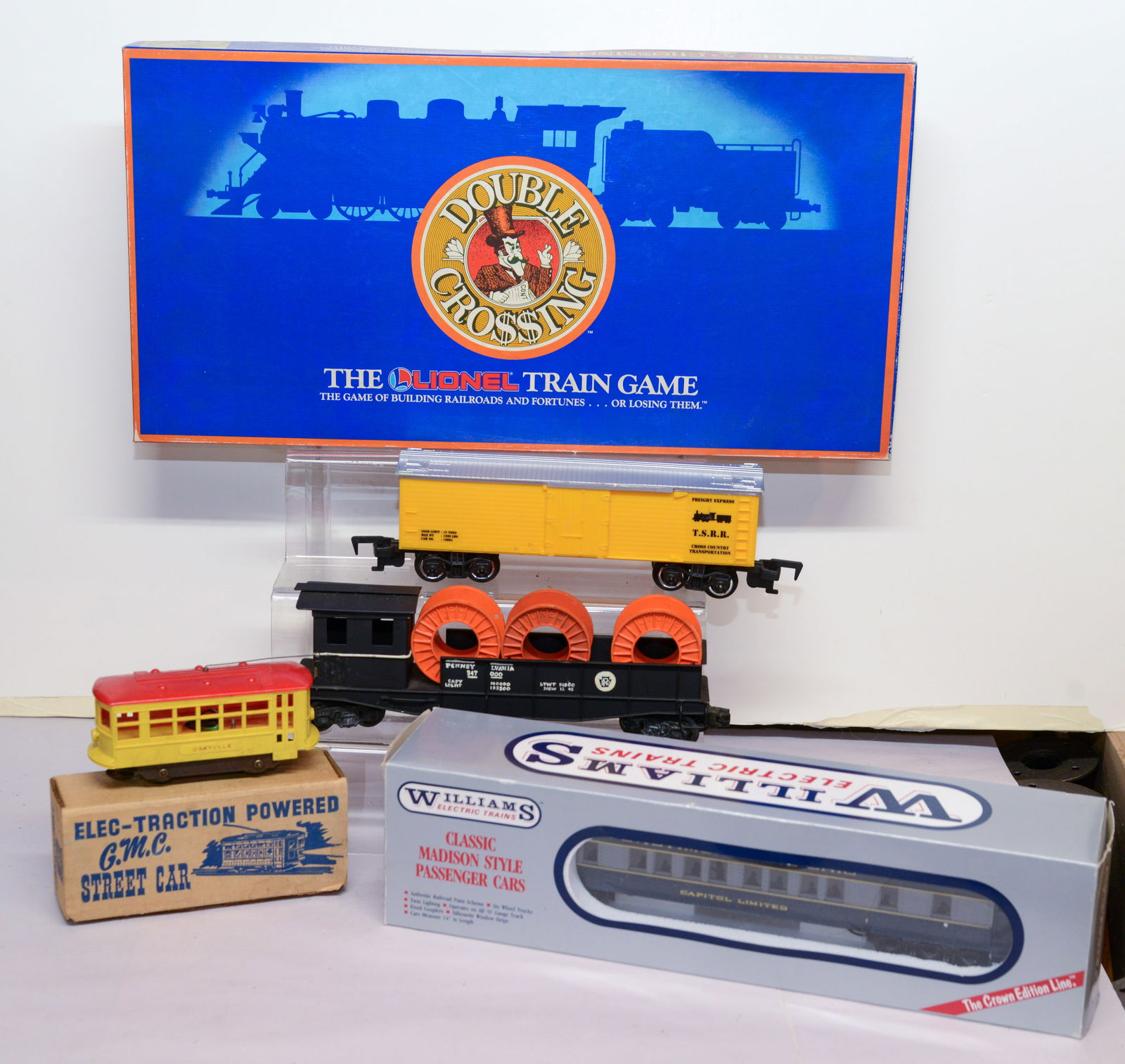 Group of Train Items.: Lionel Train Game, Dinkeyville street car, Williams passenger car, and two others.