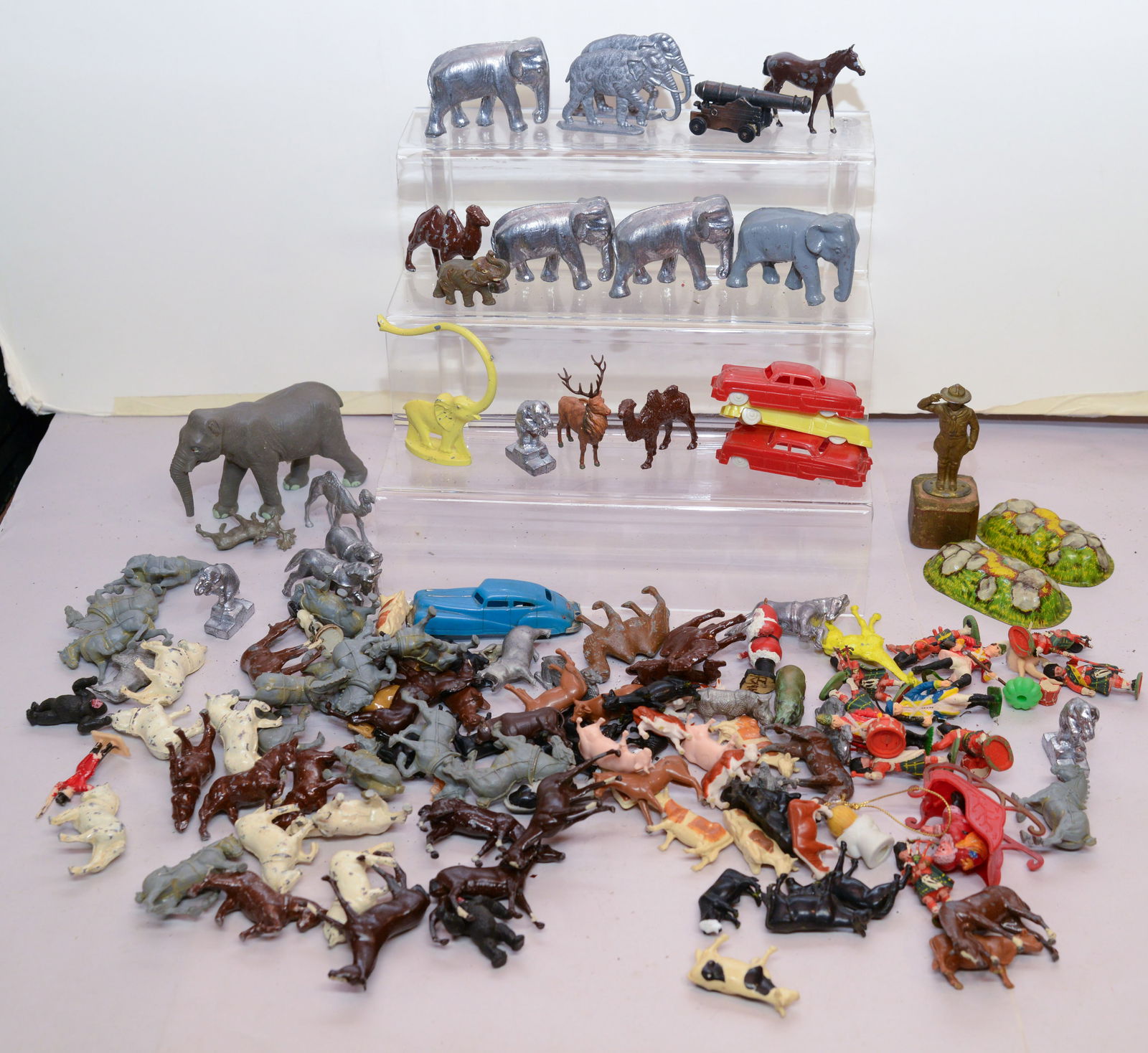 Extensive Grouping of Animal Figurines.: Elephants, horses, camels, and many others. Length of longest 3 inches.