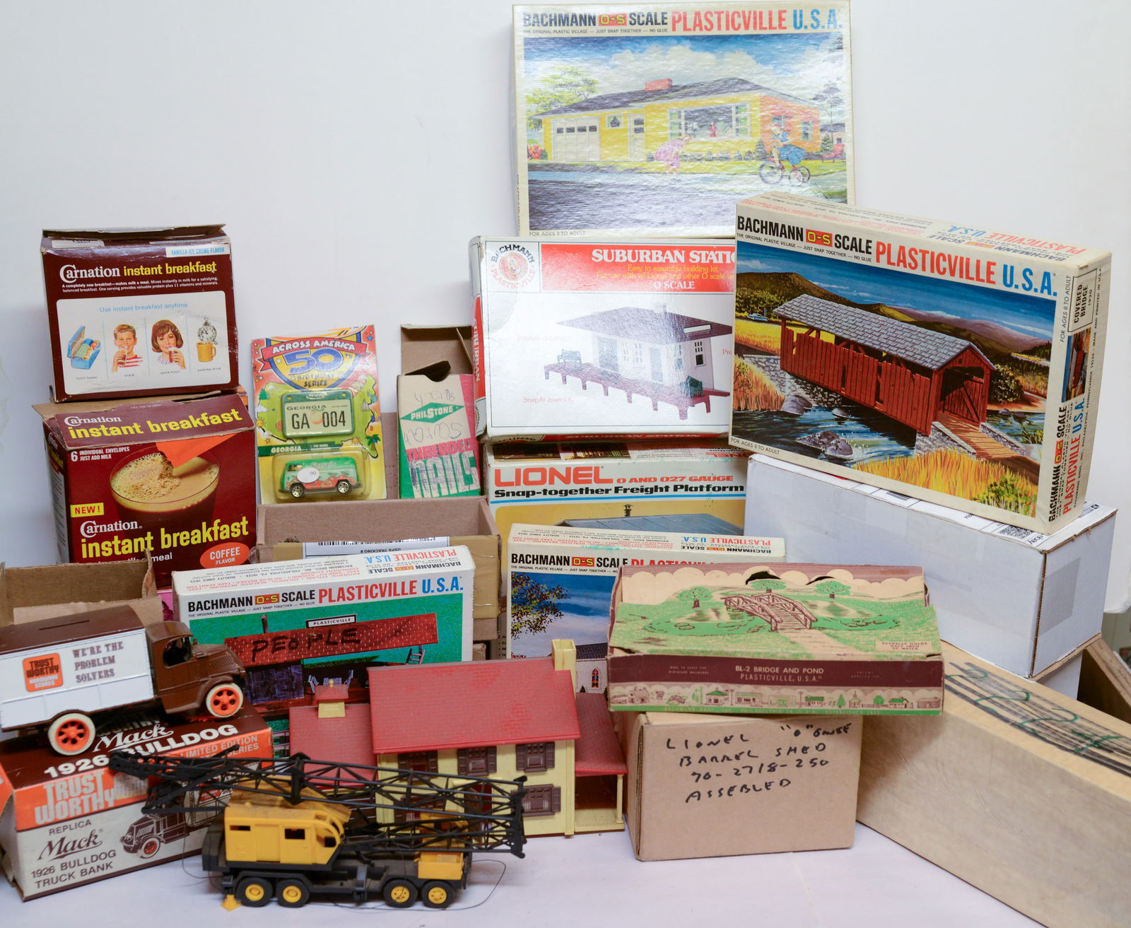 Group of Model Railroad Buildings and Accessories.: Trucks, crane, many others. Some damage.