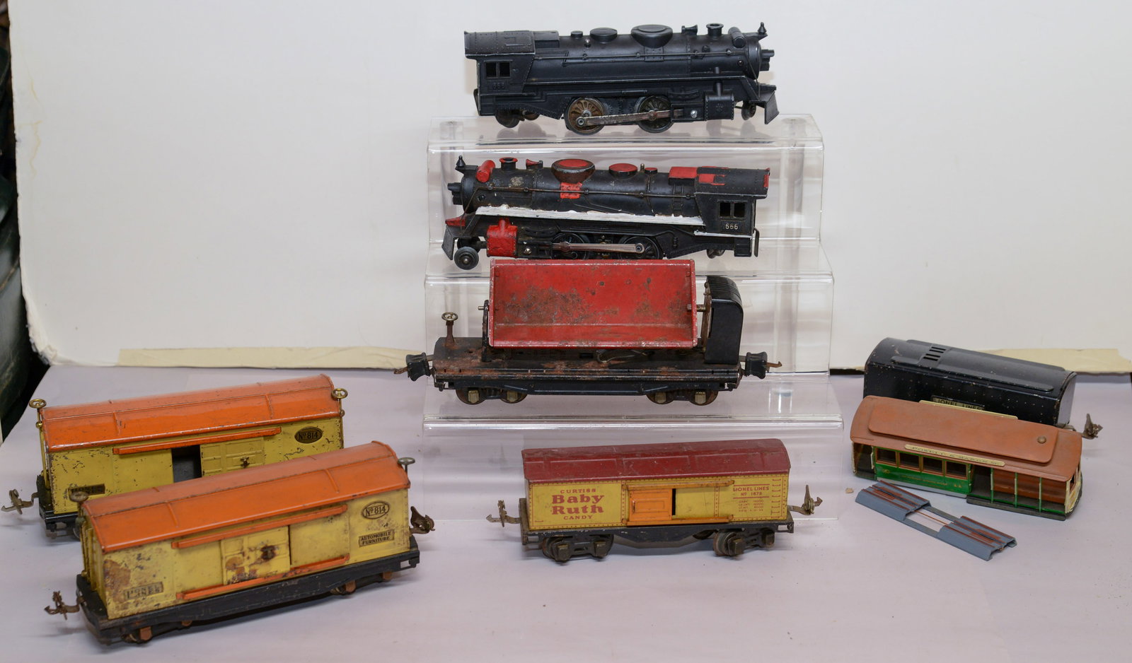 Two Lionel Locomotives and Five Cars.: 666 locomotives. Some with damage.