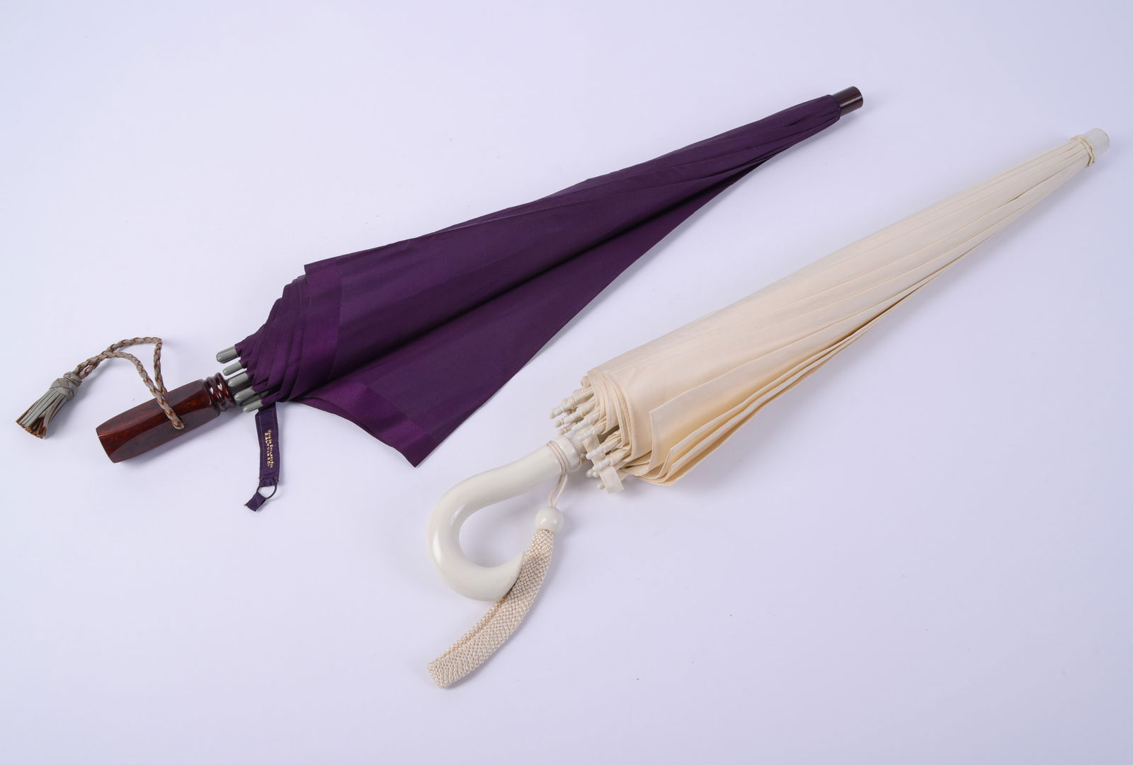 Two Mid Twentieth Century Umbrellas.: Lengths 25 inches.