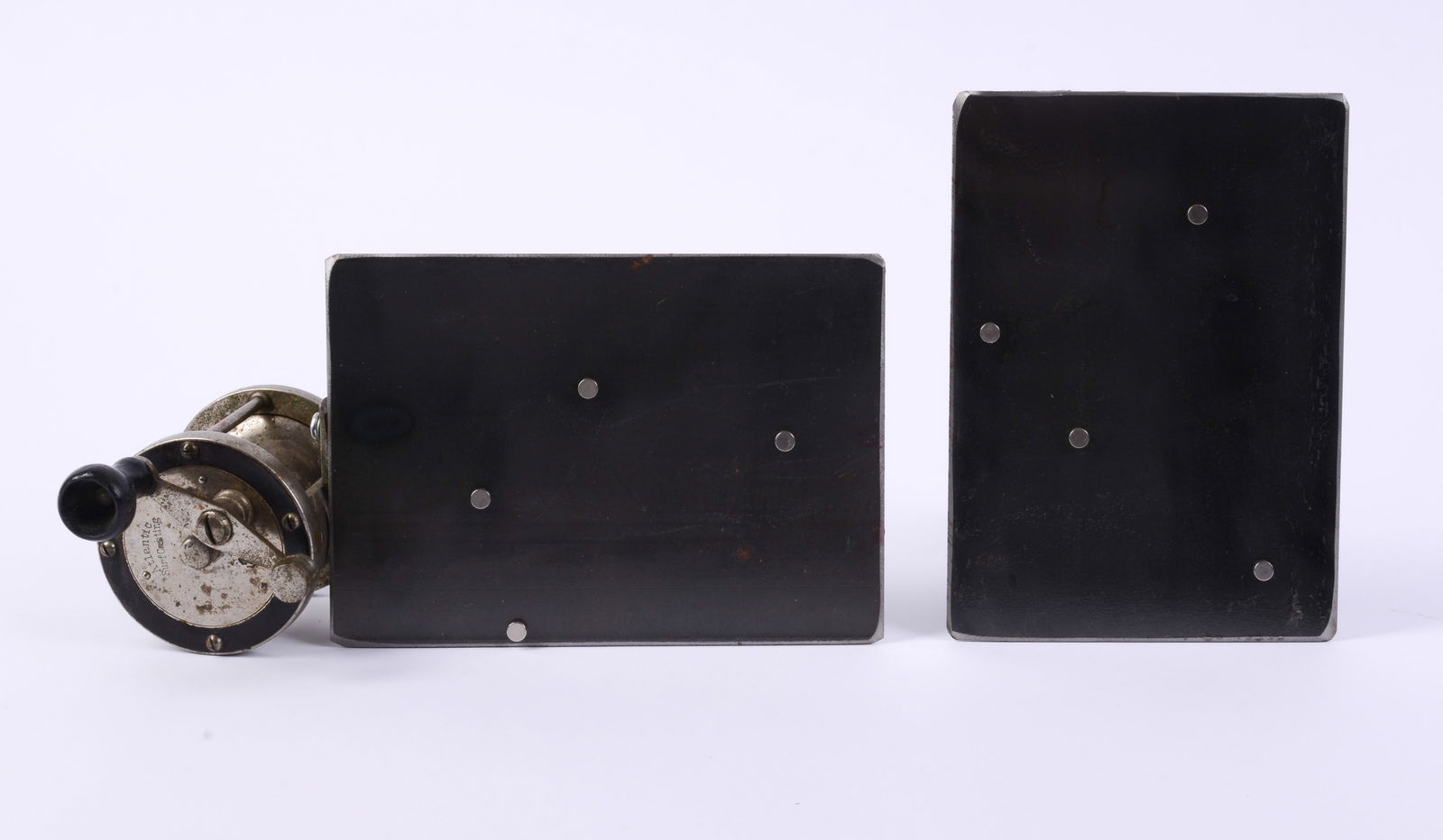 Two Metal Picture Frames.: One with doorknob, one with fishing reel, with magnets to hold 5 x 7 photos.