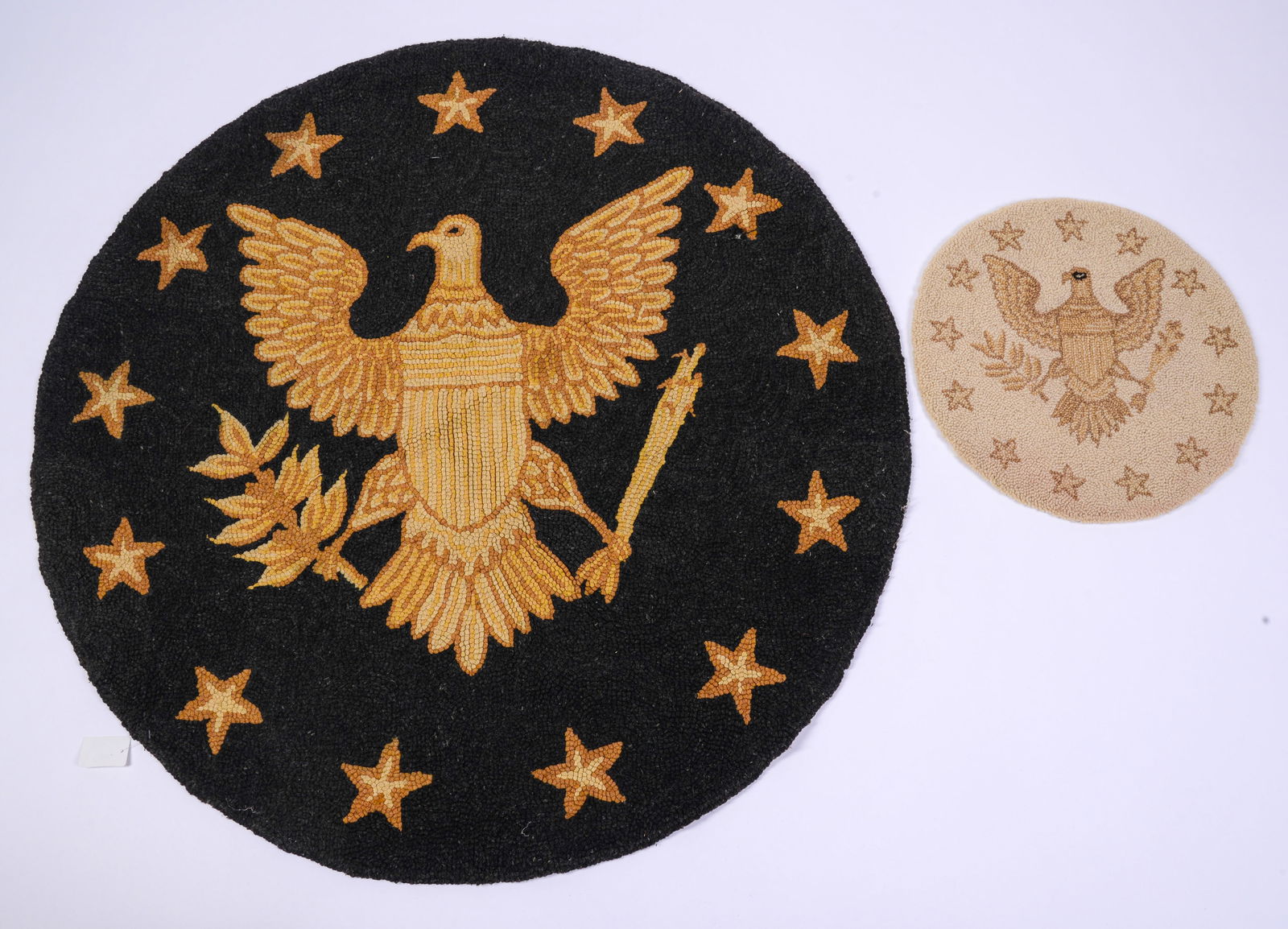 Two Hooked Mats with Eagles.: Diameters 15 and 38 inches.