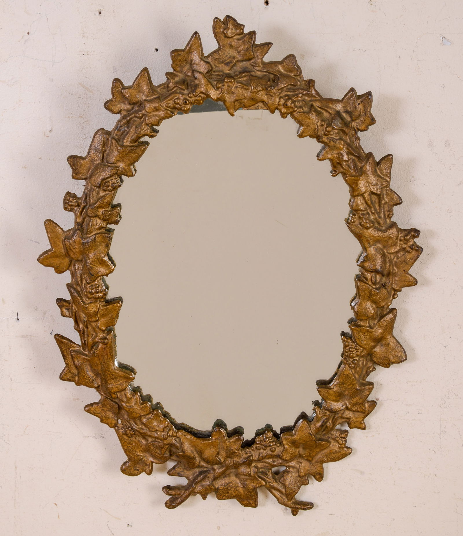 Oval Gilt Metal Mirror.: 18 x 13 inches.