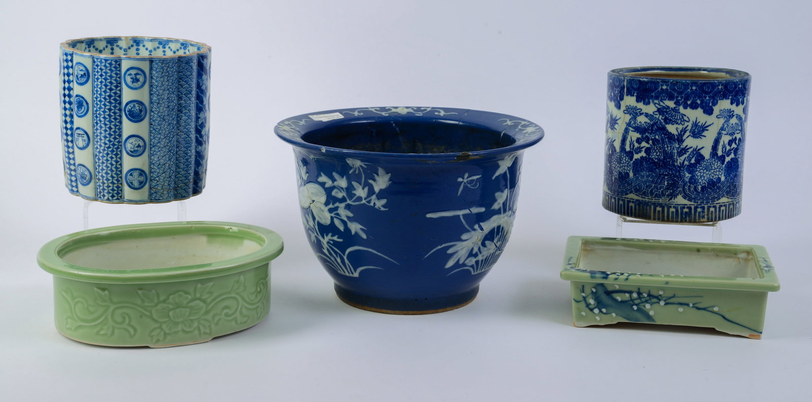 Five Chinese Blue and White, and Celadon Porcelain Planters.: Tallest 7.5 inches. Blue and white vases with repaired cracks and chips.