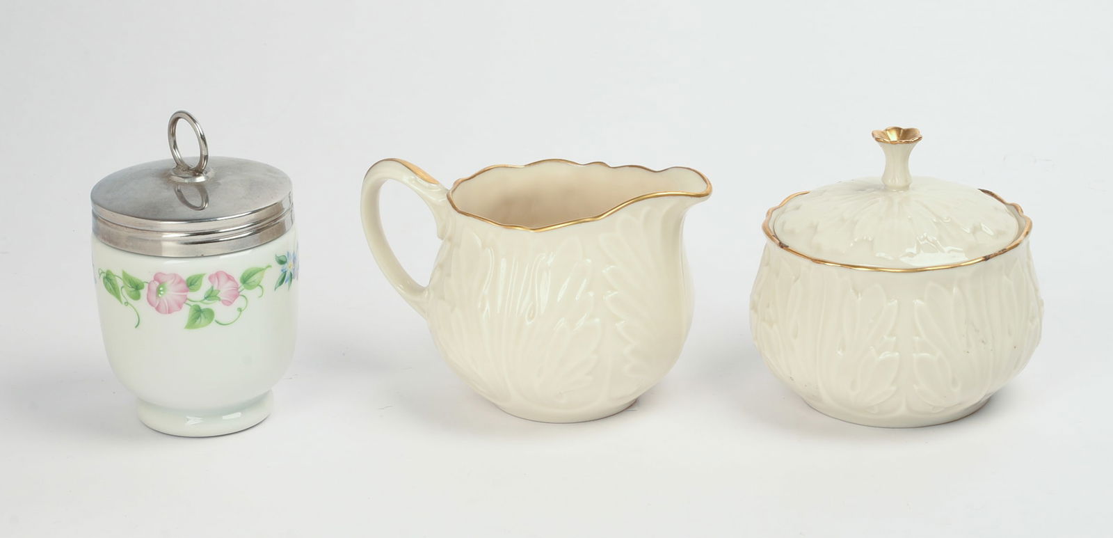 Lenox Porcelain Acanthus Leaf Pattern Creamer and Sugar with Gold Rim and Porcelain Egg Cup.: Height of creamer 3.25 inches. Good condition.