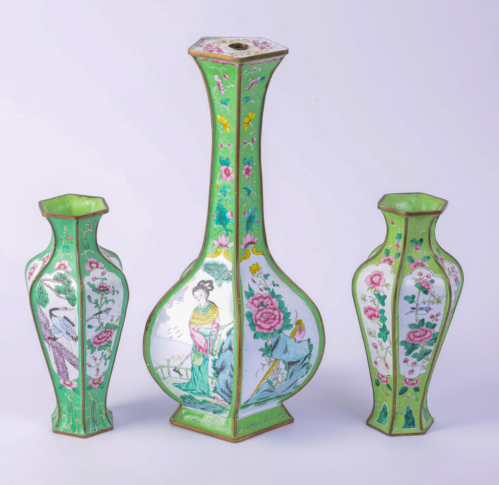 Tall Chinese Enamel Vase.: Drilled as a lamp with pair of enamel vases. All decorated with flowers, birds and a figure on green ground. Height of tall lamp 15 inches. Good condition.