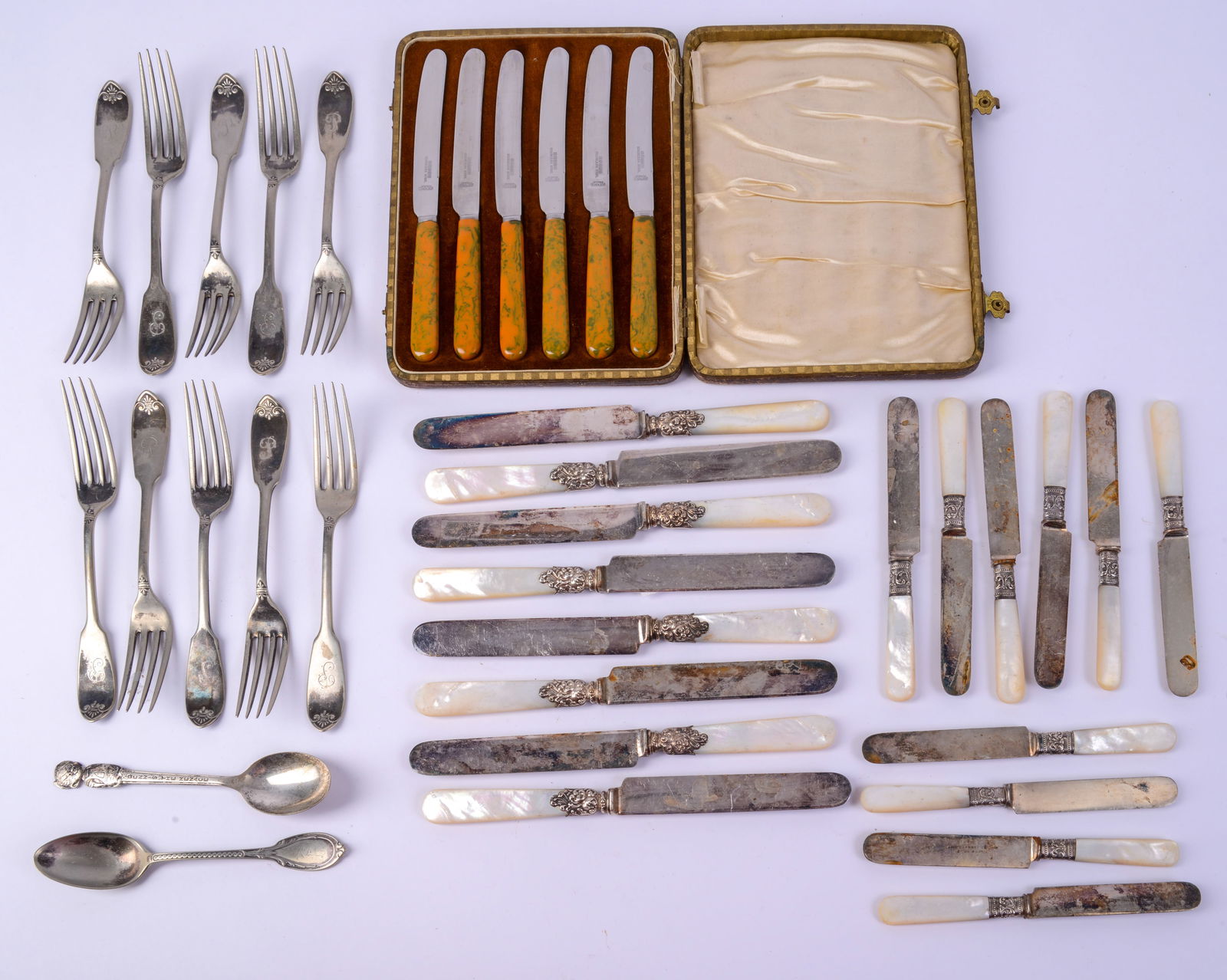 Eight Mother of Pearl and Silver Plate Knives.: With ten small mother of pearl and silver plate knives. With six knives with resin handles in case, and other forks and spoons. Larger knives length 8.25 inches.