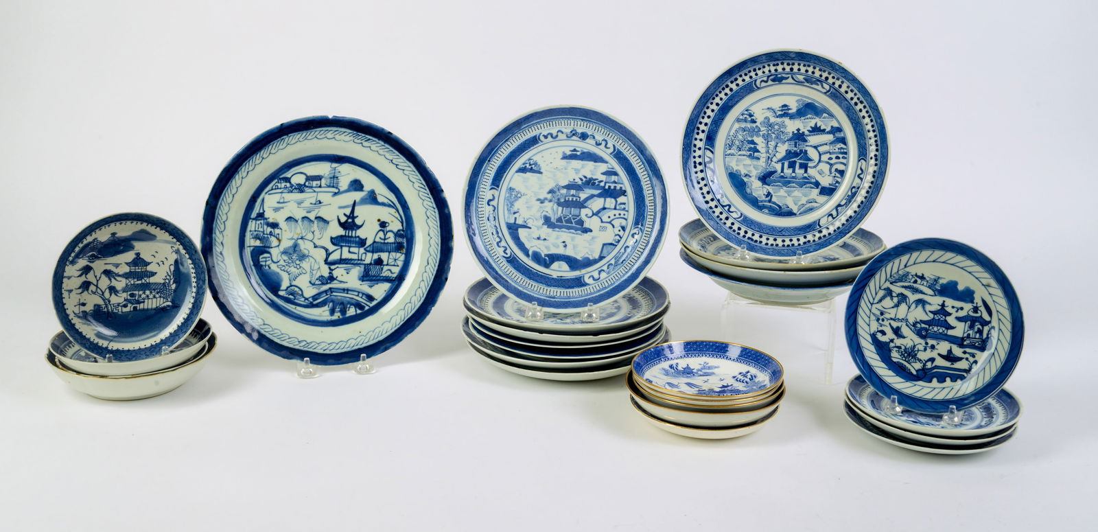 Seven Chinese Canton Blue and White Salad Plates.: Including Canton dinner plate, 4 bowls and other Canton and Flow Blue small plates. Dinner plate diameter 10 inches. Some rim chips.