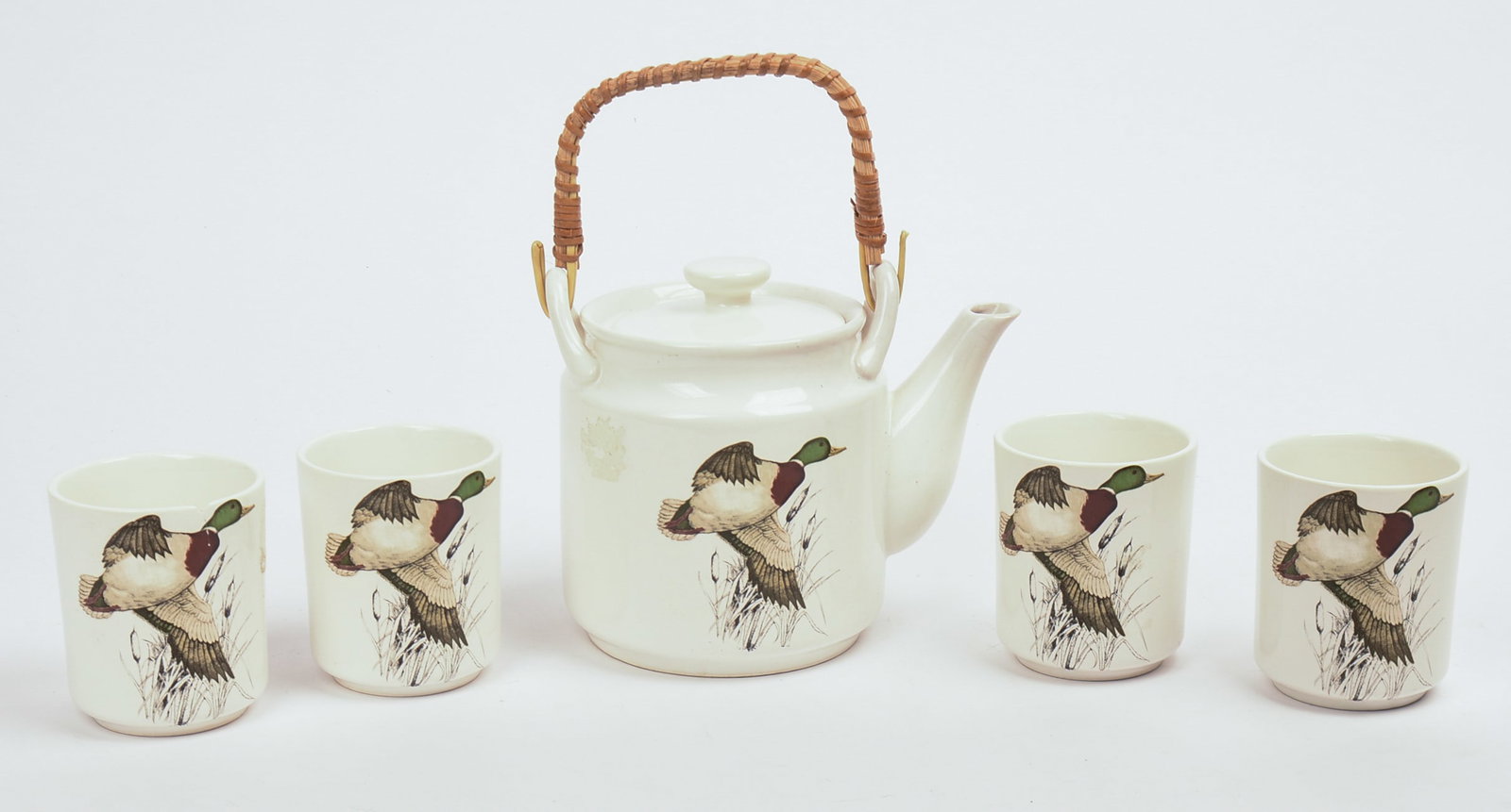 Japanese Porcelain Bird Decorated Teapot with Four Cups.: Height of teapot 8 inches. One cup with rim chip and hairline.
