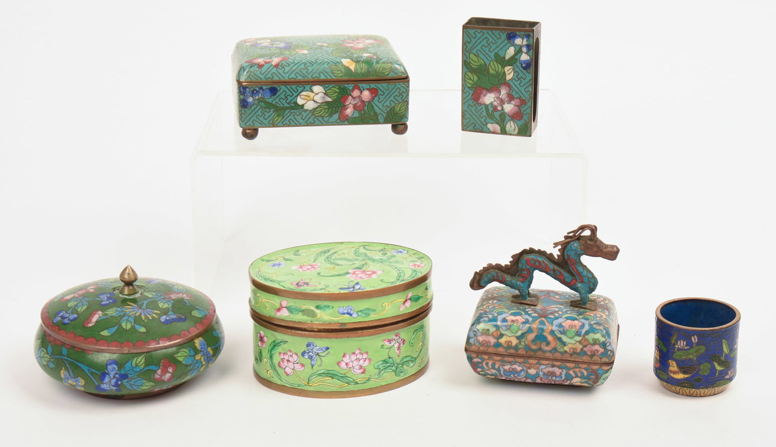 Four Enamel Covered Boxes.: With enamel matches case and small cup. Largest box width 3.75 inches.