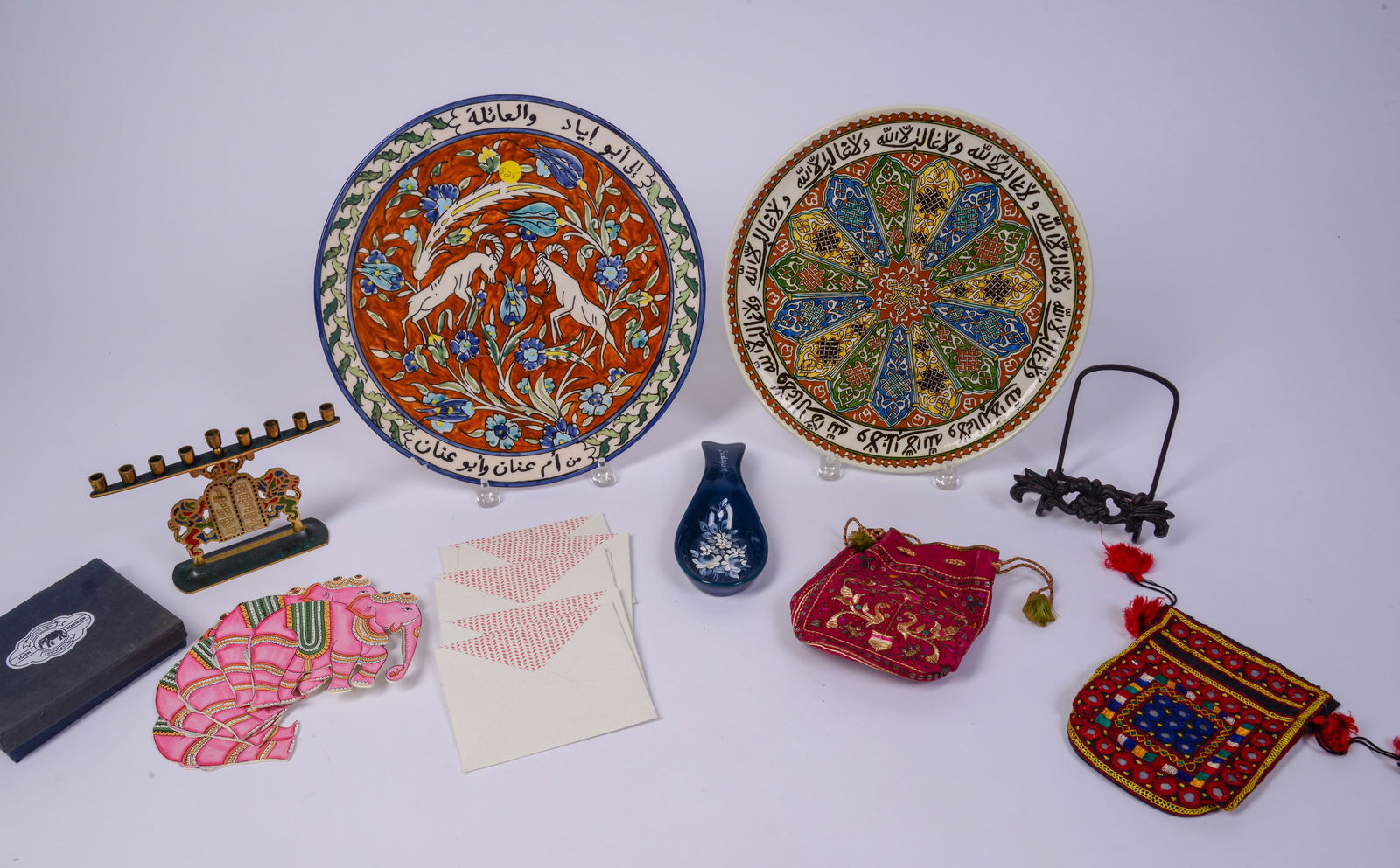 Two Islamic Decorated Chargers with Metal Candle Holder.: With two beaded small bags, elephant stationery, spoon rest and metal holder. Largest charger diameter 13.25 inches. Good condition.