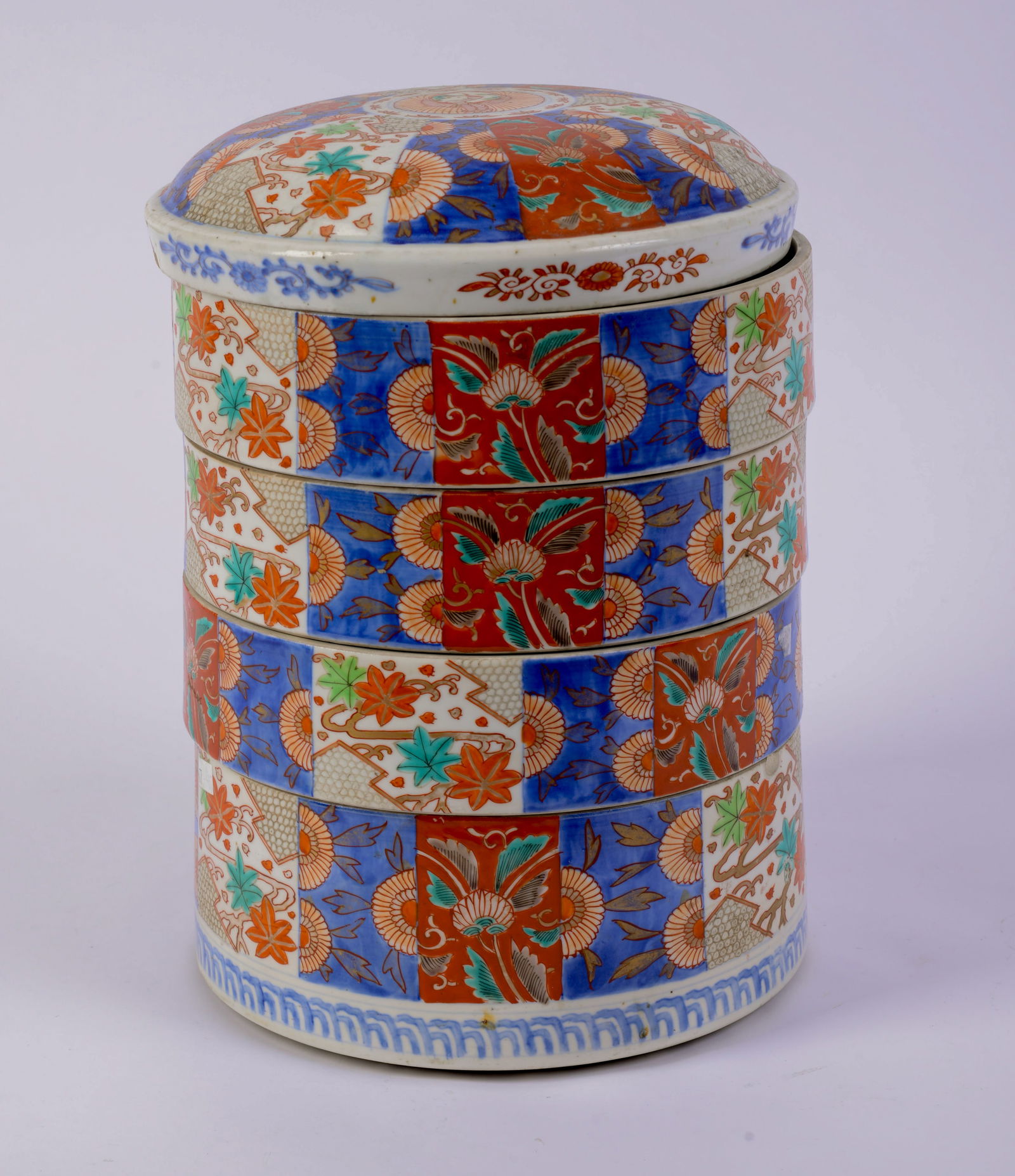 Chinese Porcelain Polychrome Decorated Food Stacking Bowls.: With lid. Height 13 inches. Good condition.