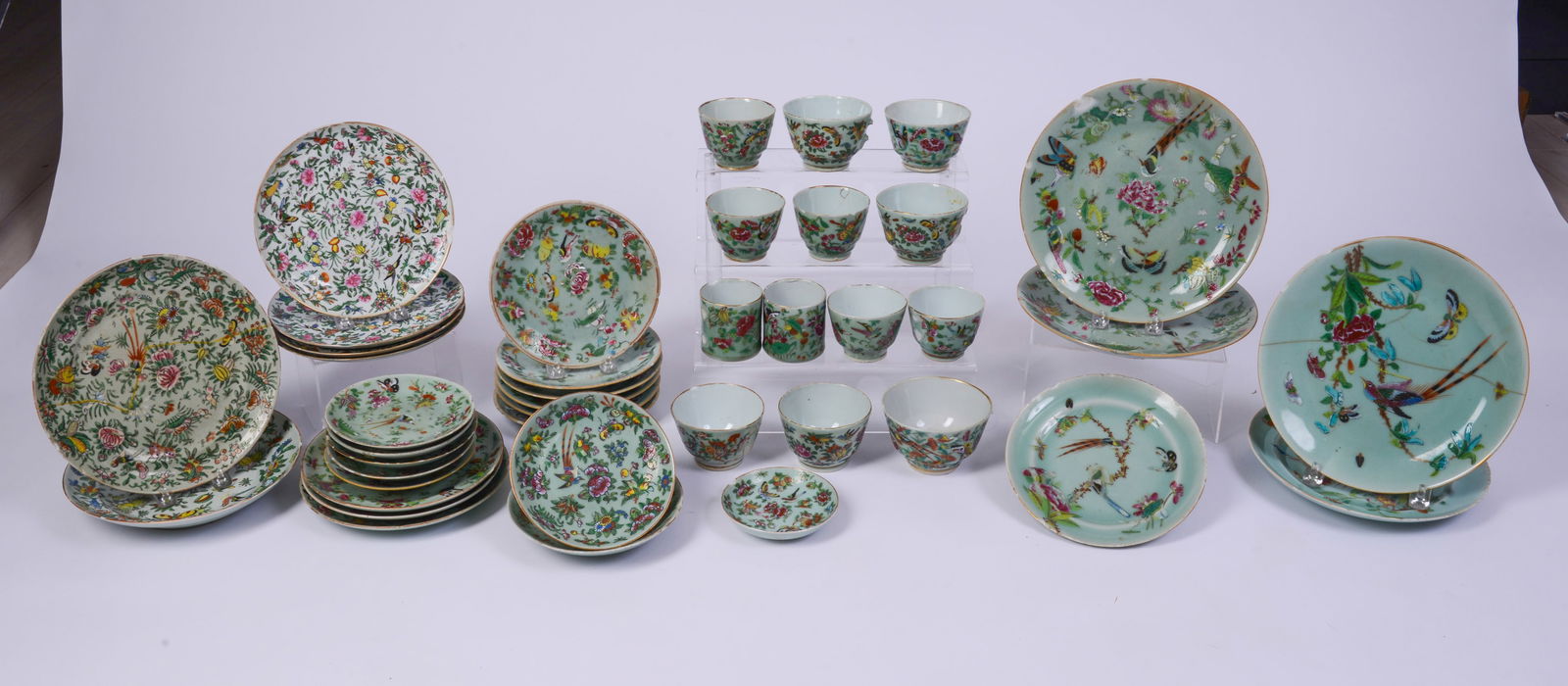 Large Group of Celadon Floral Decorated Chinese Dinnerware.: Including 4 dinner plates, 14 small plates, 13 cups, 6 saucers and 4 other floral Chinese plates. Dinner plate diameter 9.75 inches. Chipped rims and some missing handles.