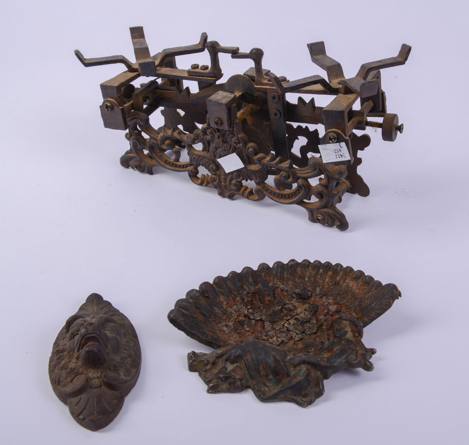 Three Cast Iron Items. - 3