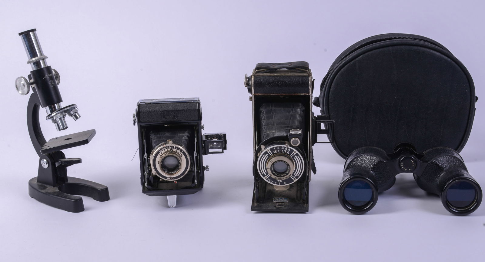 Two Cameras, Binoculars, and a Microscope.: Welta and Zeiss Ikon.