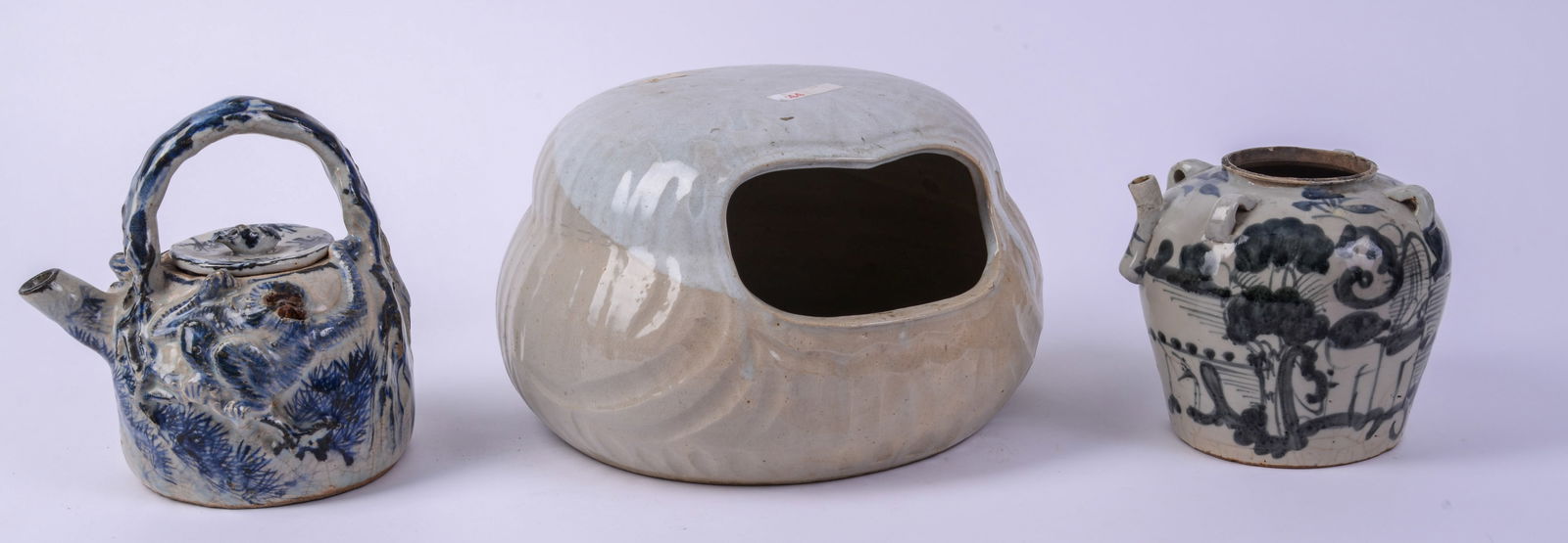 Three Chinese Porcelain Items.: Teapot, height 8.5 inches, a vase, and a warming dish.