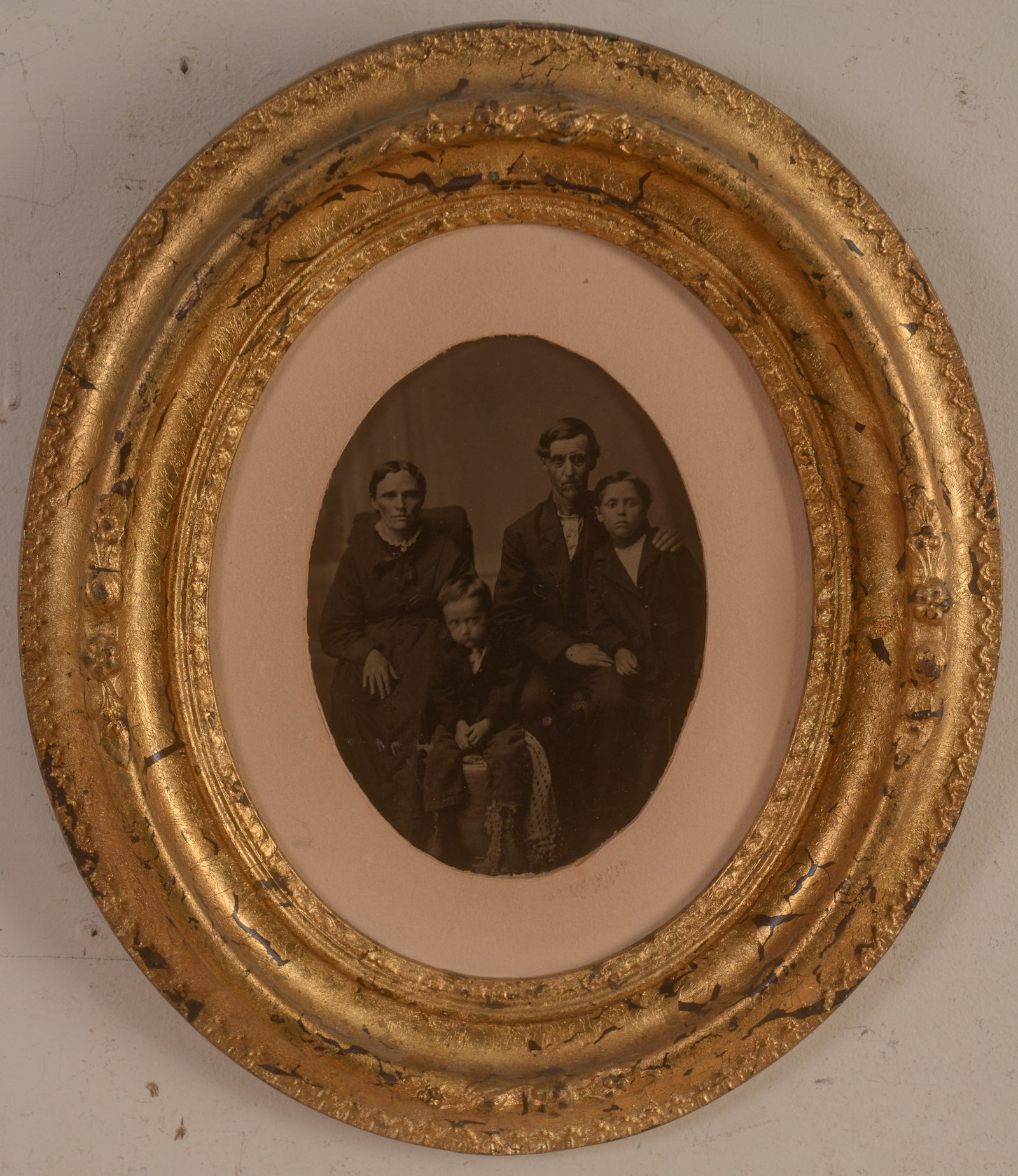 19th Century Photograph of a Family.: 7 x 5 inches. In an oval gilt frame, overall 14 x 12 inches.