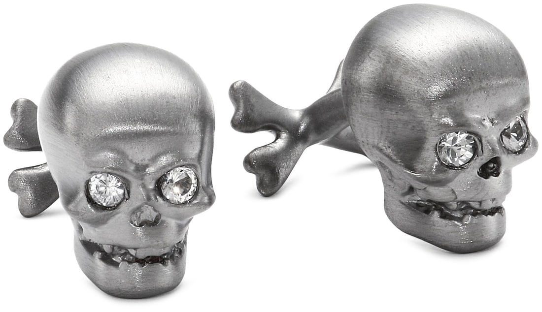 ROTENIER "Novelty" Sterling Silver Black Skull with Sapphire Cufflinks: Sterling Silver Black Rhodium Brushed Skull set with White Sapphires and Crossbones Cufflinks Due to the natural elements of sapphire, the stone may vary in color, size or shape. Brushed, black rhodiu
