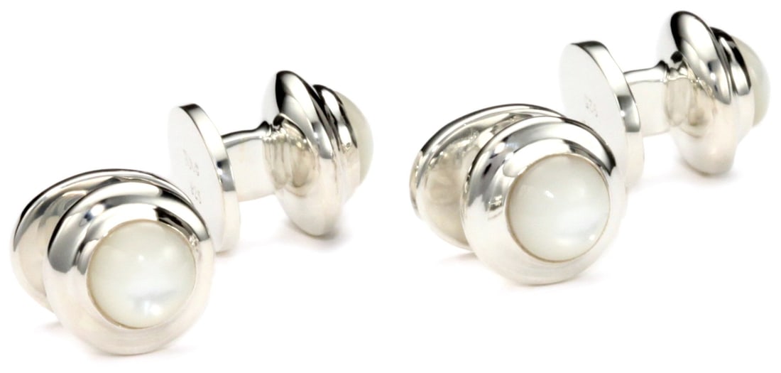 ROTENIER "Classic" Sterling Silver Globe with Mother-Of-Pearl Studs: Sterling Silver Globe set with Mother-of-Pearl Studs Due to the natural elements of Mother-of-Pearl, the stone may vary in color, size or shape. Four shirt studs, shaped like a globe Made in United St
