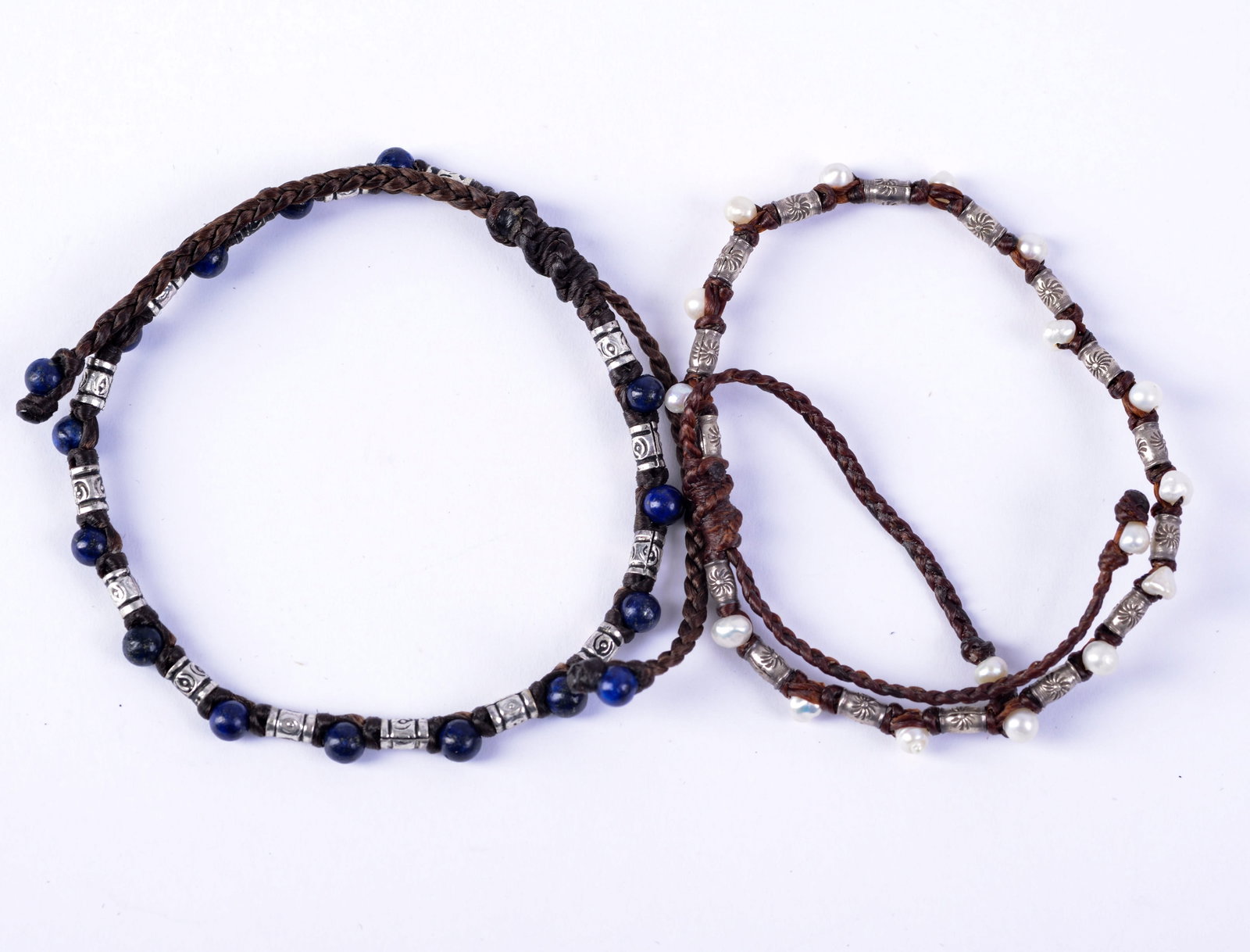 Two Beaded Bracelets.: Possibly pearl, lapis, and silver. Width of bracelet 2.25 inches