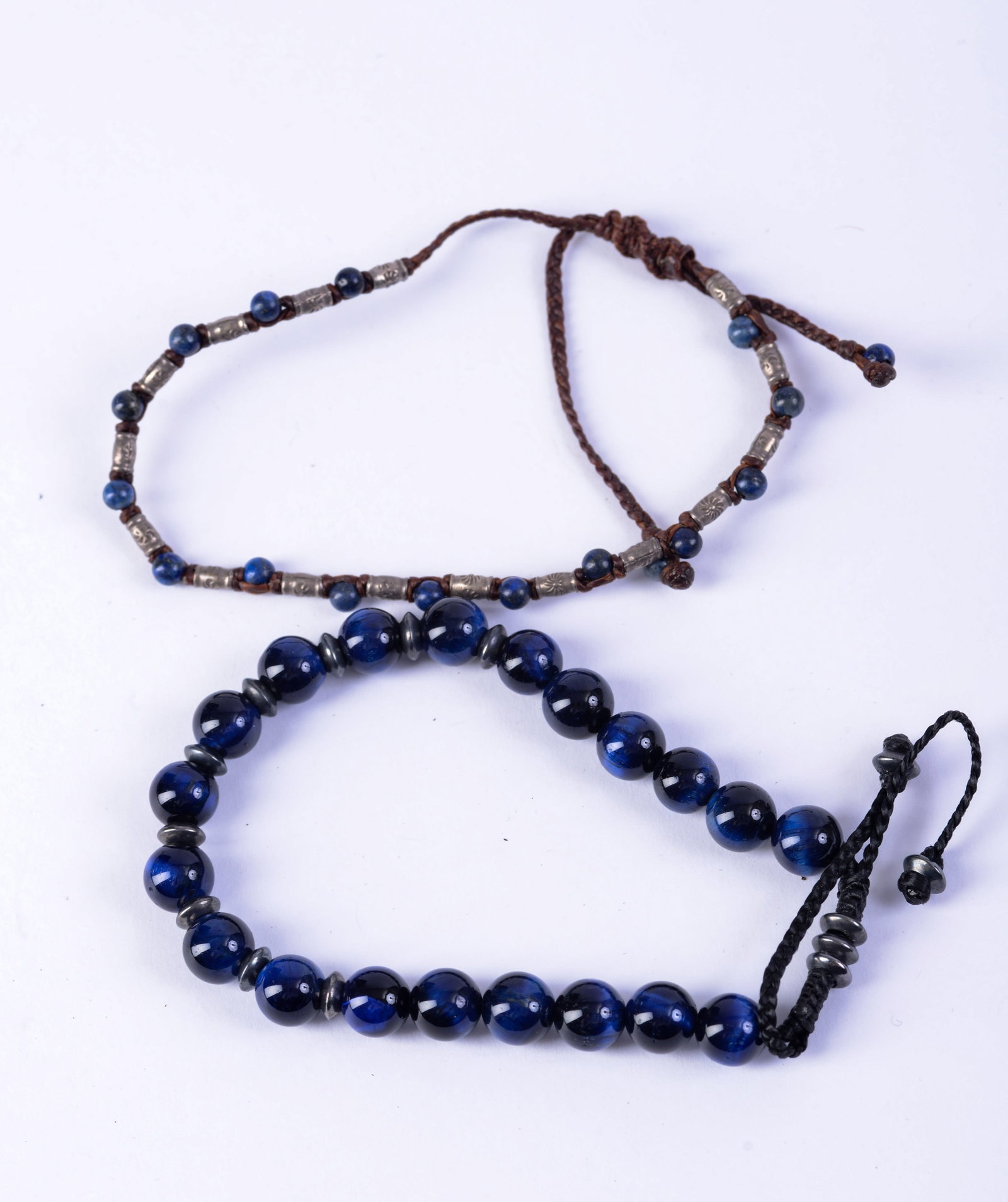 Two Beaded Bracelets.: One possibly lapis and silver. Width of bracelet 2.25 inches.