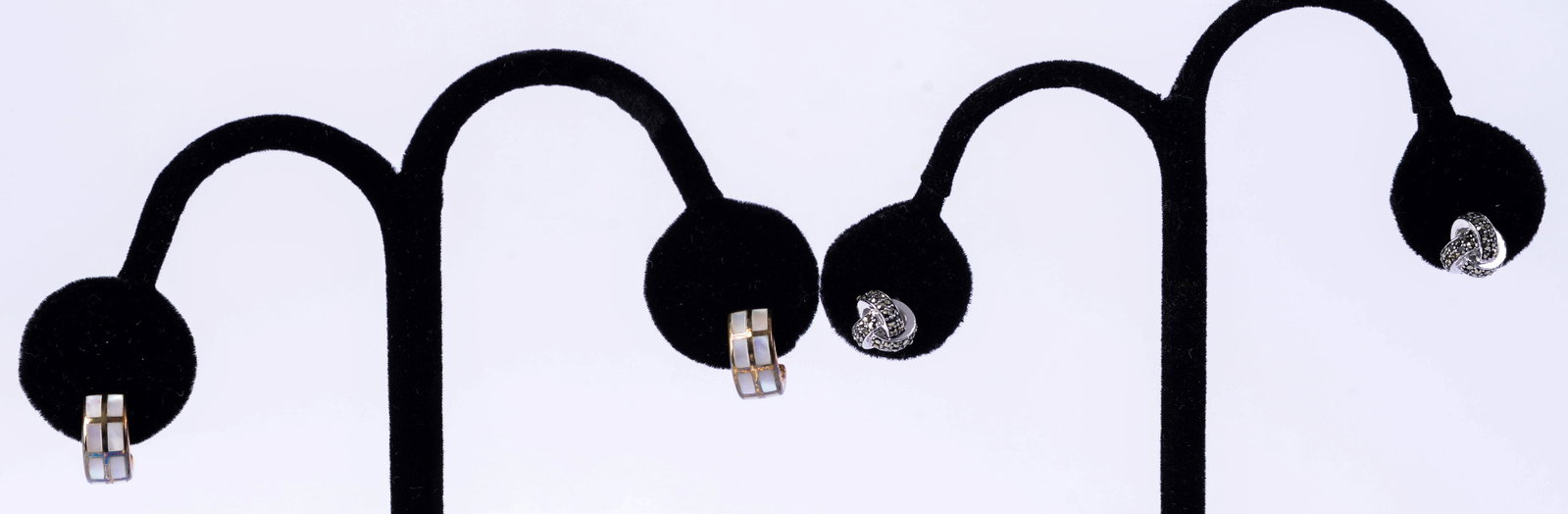 Two Pairs Jan Leslie Sterling Earrings.: One pair studs with rhinestones, the other with gold color and possible mother of pearl inlay. Golden earrings with some discoloration.