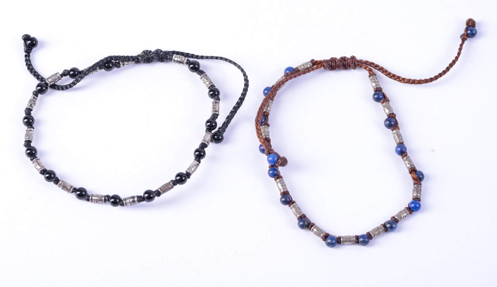 Two Beaded Bracelets.: Possibly lapis, silver, and black beads. Width of bracelet 2.25 inches.