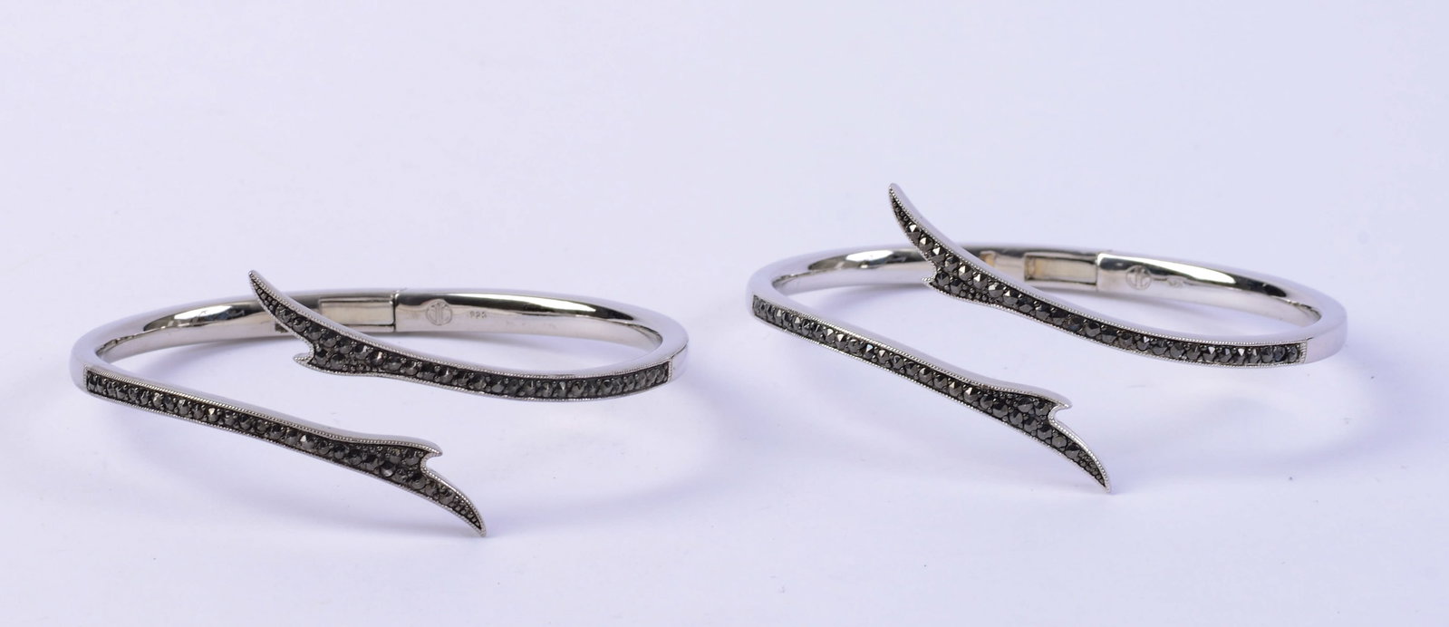 Two Jan Leslie Sterling Hinged Bracelets with Rhinestones.: Width of bracelet 2.25 inches.