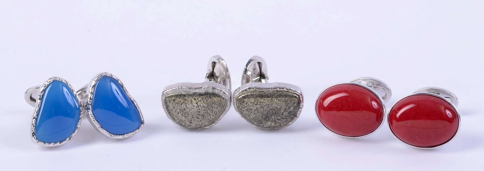 Three Pairs Sterling Jan Leslie Cufflinks.: Oval-like shapes in blue, red, and flecked greenish gold.