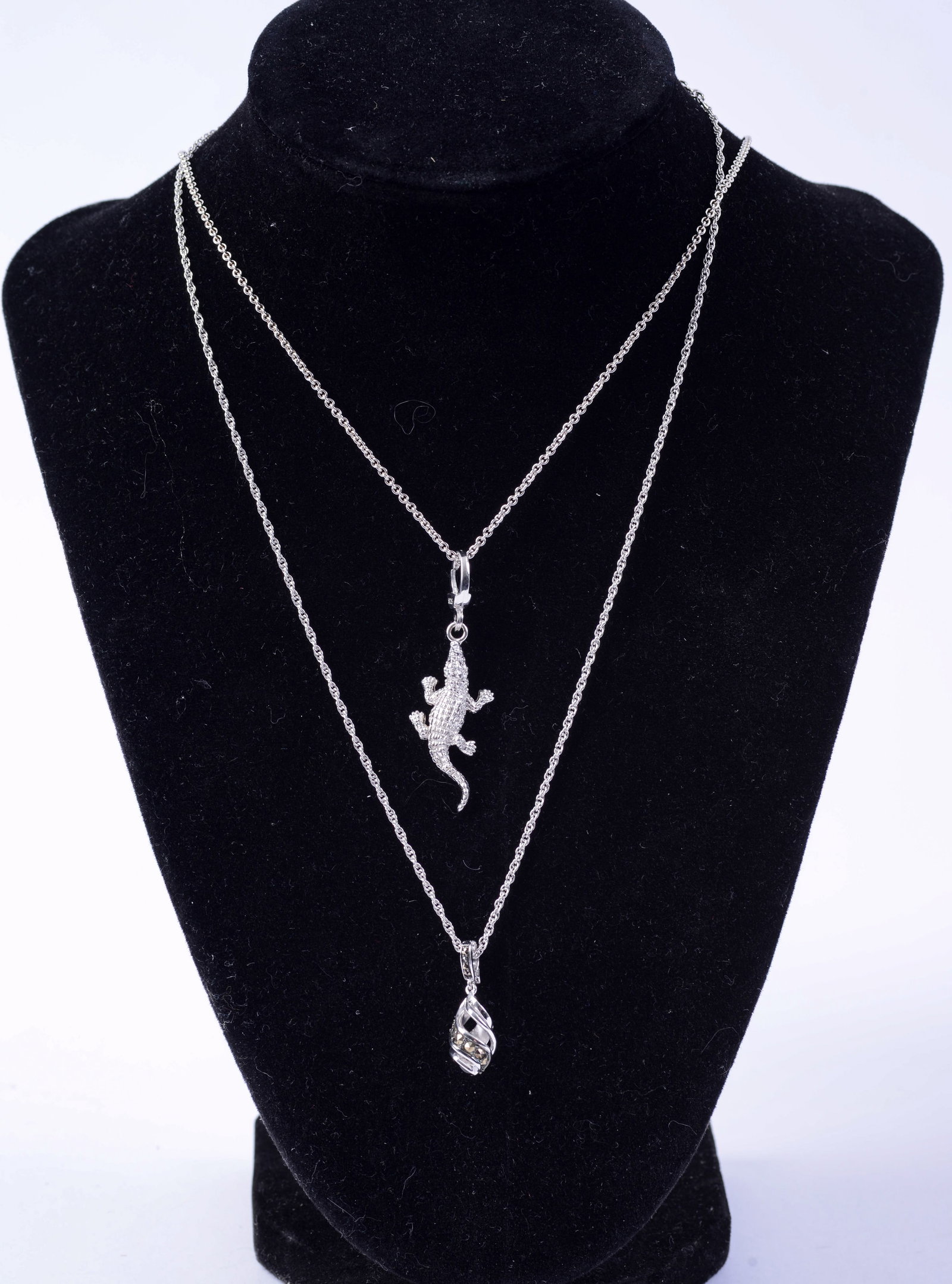 Two Sterling Jan Leslie Necklaces.: One ribbon ball and caiman.