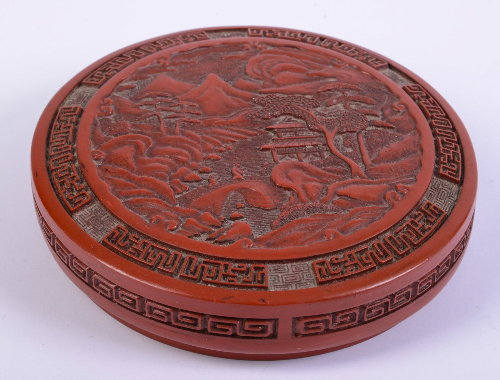 Asian Carved Red Cinnabar Covered Box: Diameter 5.75 inches.