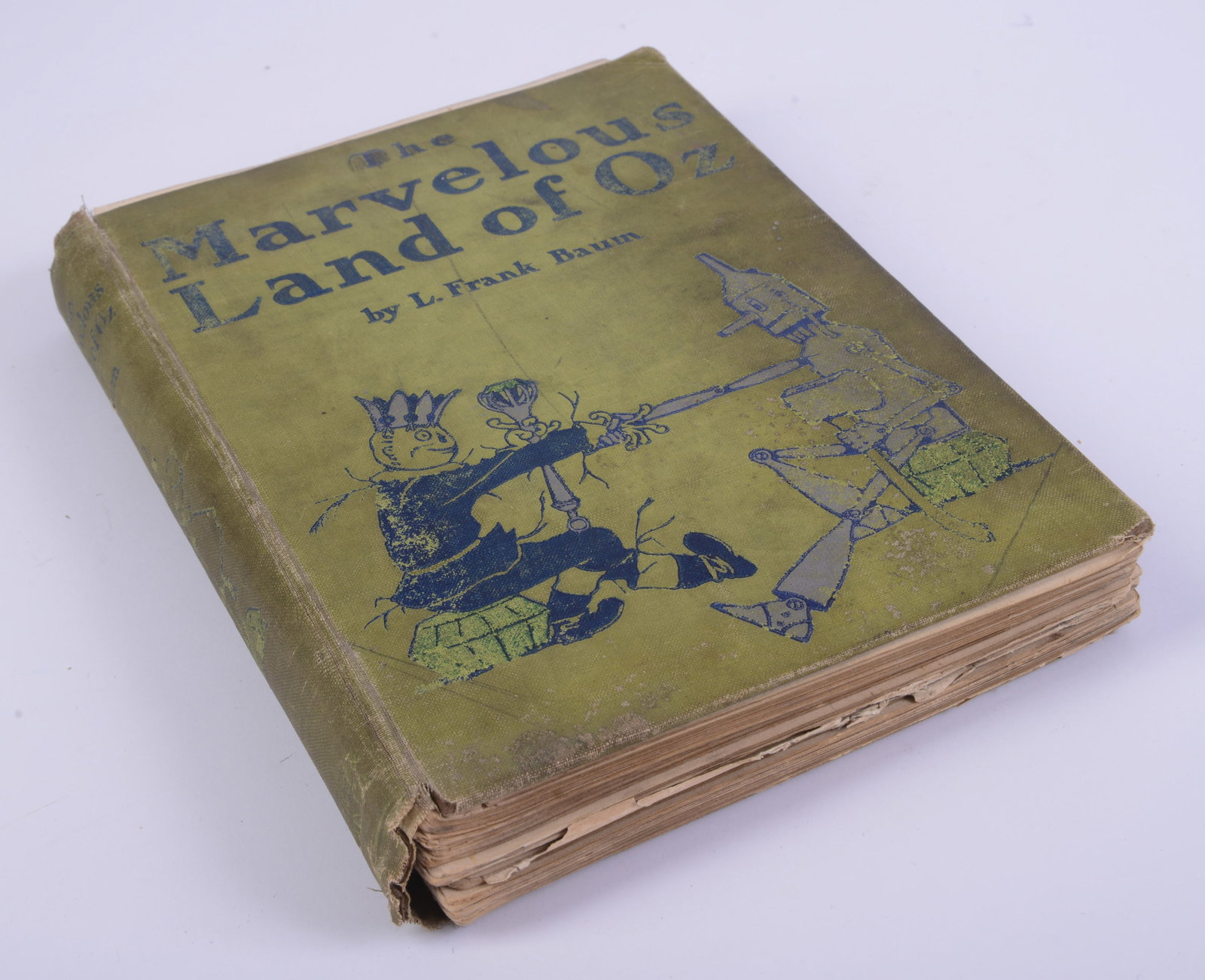 First Edition The Marvelous Land of Oz by L. Frank Baum.: Binding damaged, some minor tears to page. With color illustrations.