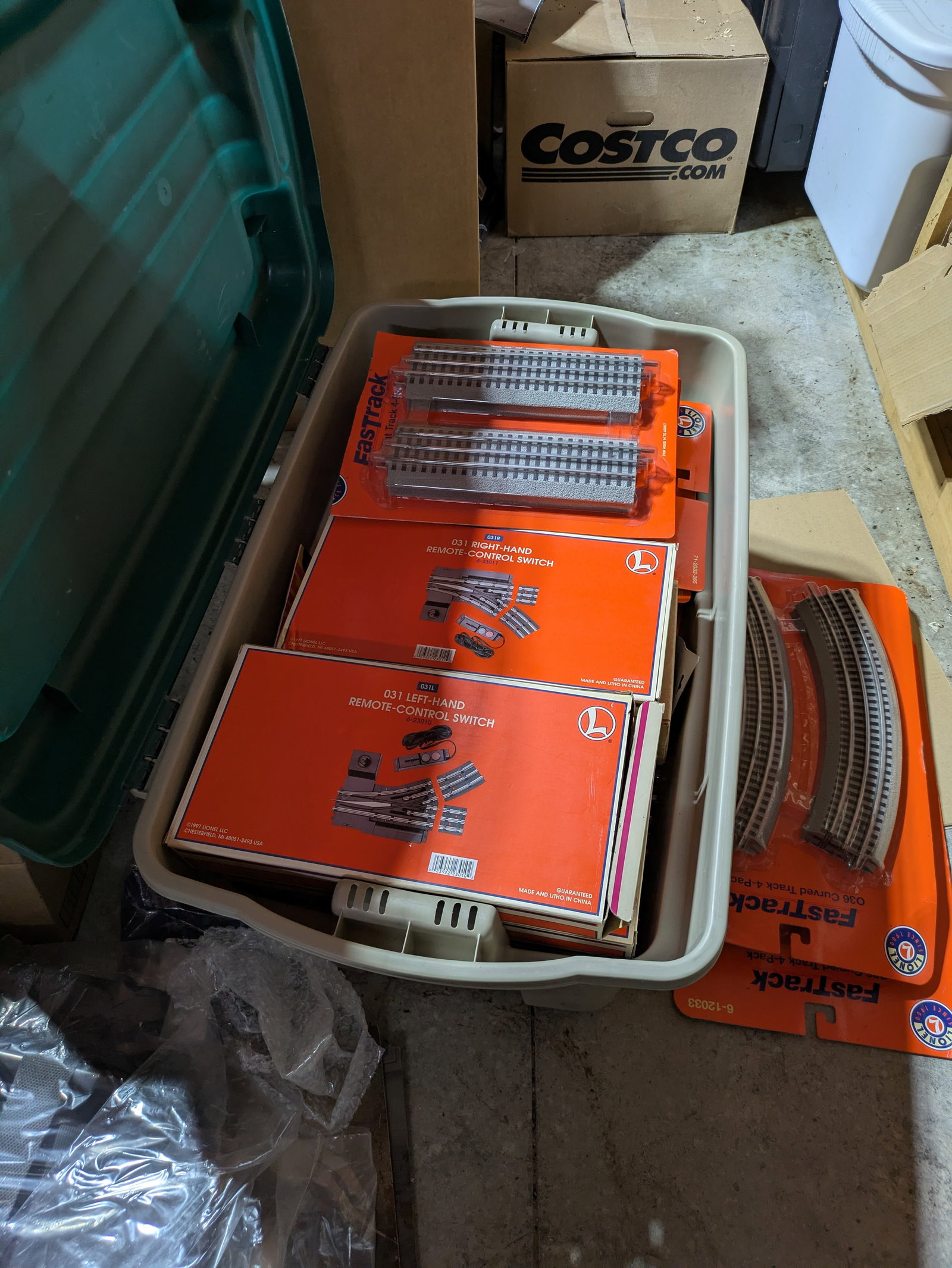 Bin of Lionel Track, Switches, and Transformers.: Much new in box.
