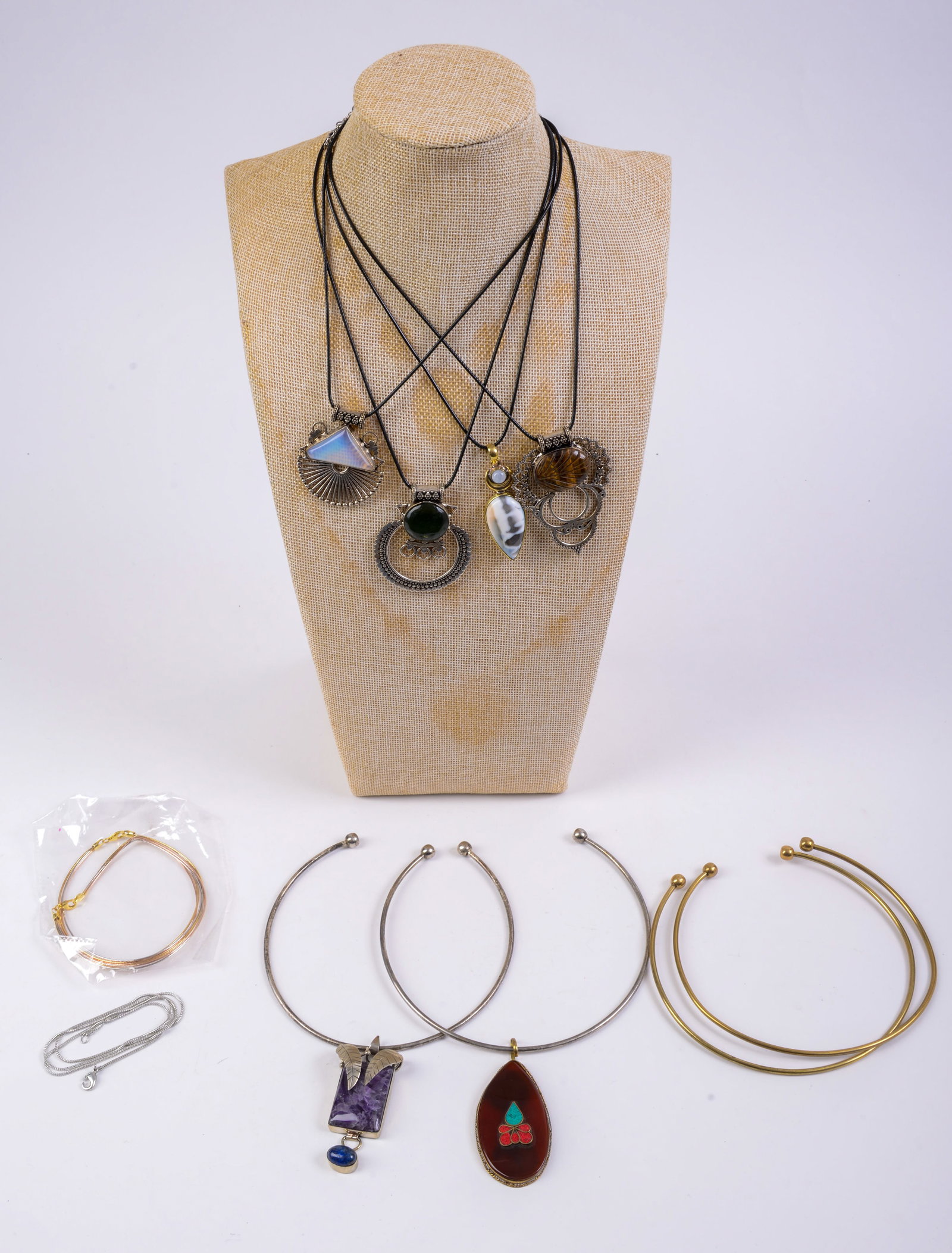 Group of Costume Pendants and Choker Necklaces.: Various metals and stones. Largest pendant length 3 inches.