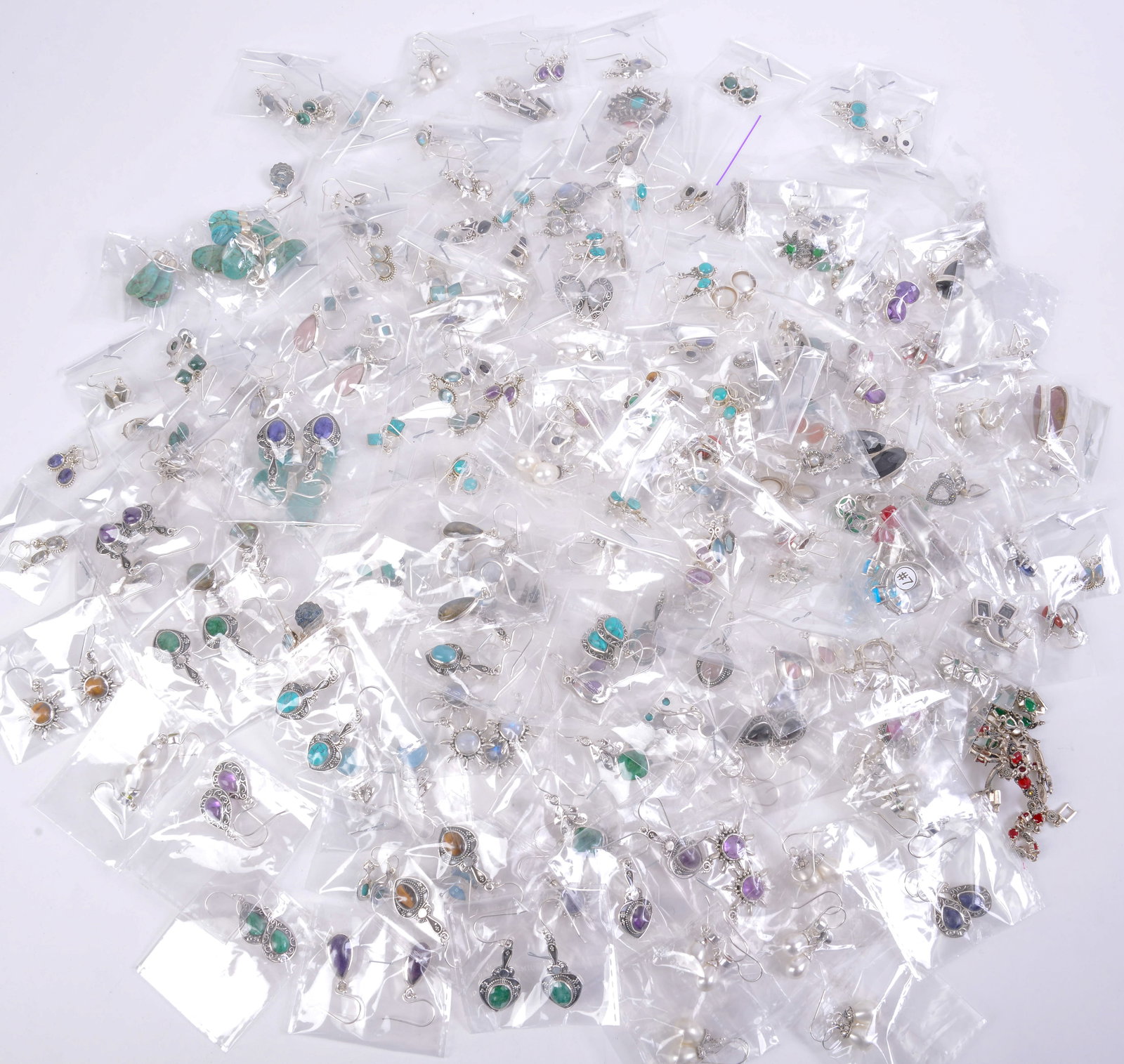 Large Group of Costume Earrings.: Some sterling. Including 2 rings. Average earring length 1.5 inches.
