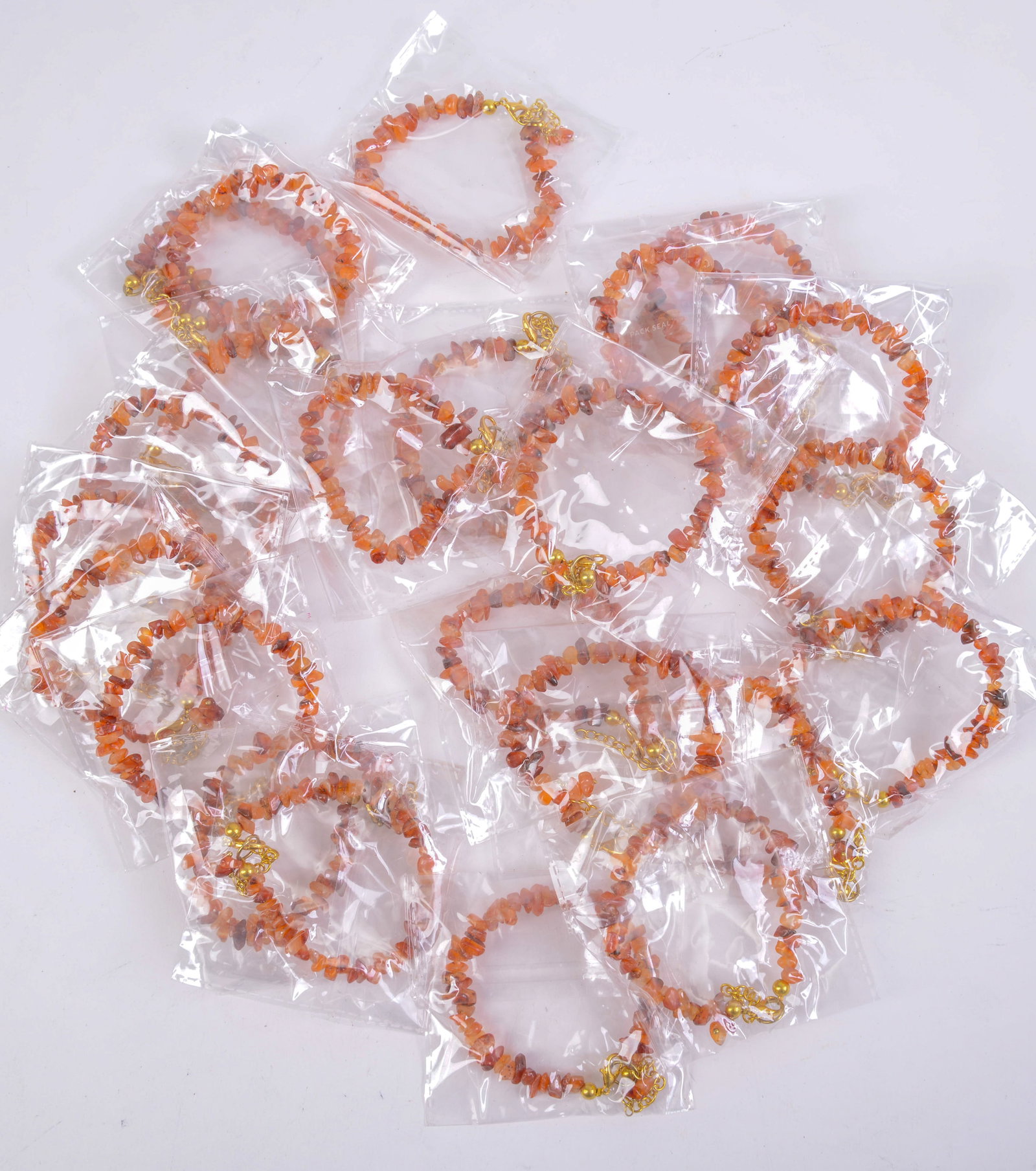 Large Group of Orange Crystal Bracelets.: Length 7 inches.