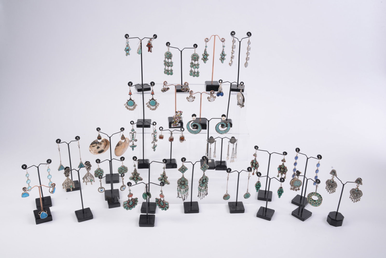 32 Pairs of Costume Jewelry Earrings.: New condition, various stones. Includes stands.