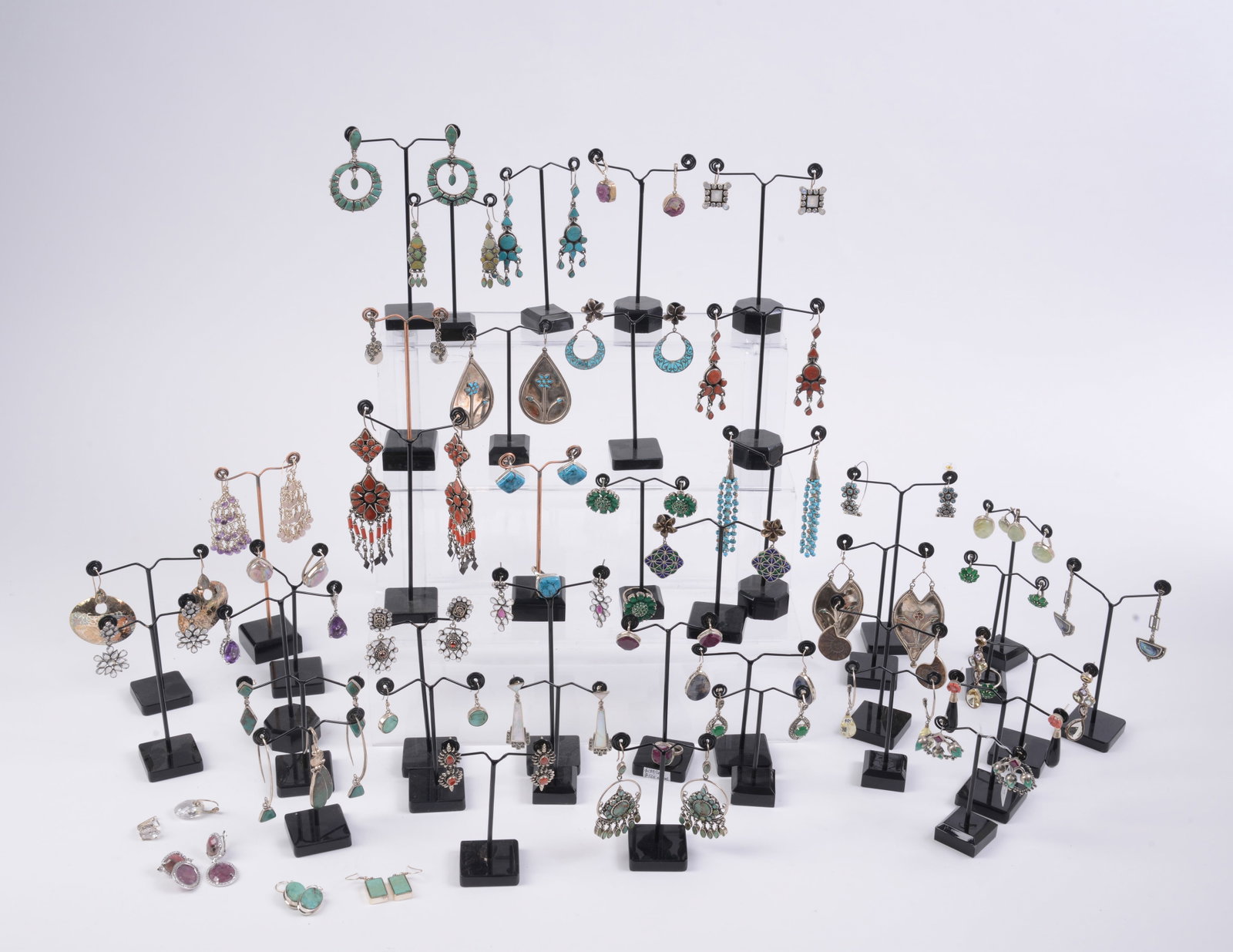 45 Pairs of Costume Jewelry Earrings.: New condition, various stones. Includes stands.