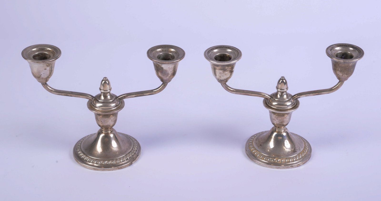 Pair of Newport Weighted Sterling Candelabra.: Height 6 inches.