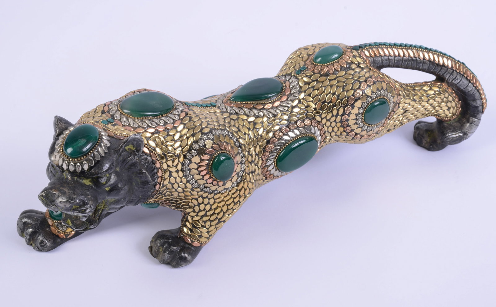 Nepalese Mixed Metal Lion Sculpture.: Length 17 inches.